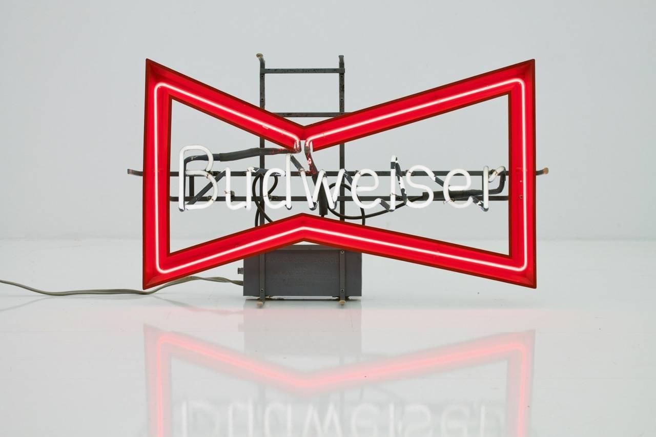 This neon sign by Budweiser was brought from the USA by the previous owner in the late 1980s. There is a transformer installed which allows operation at 110 and 220 volts. The piece remains fully functional.