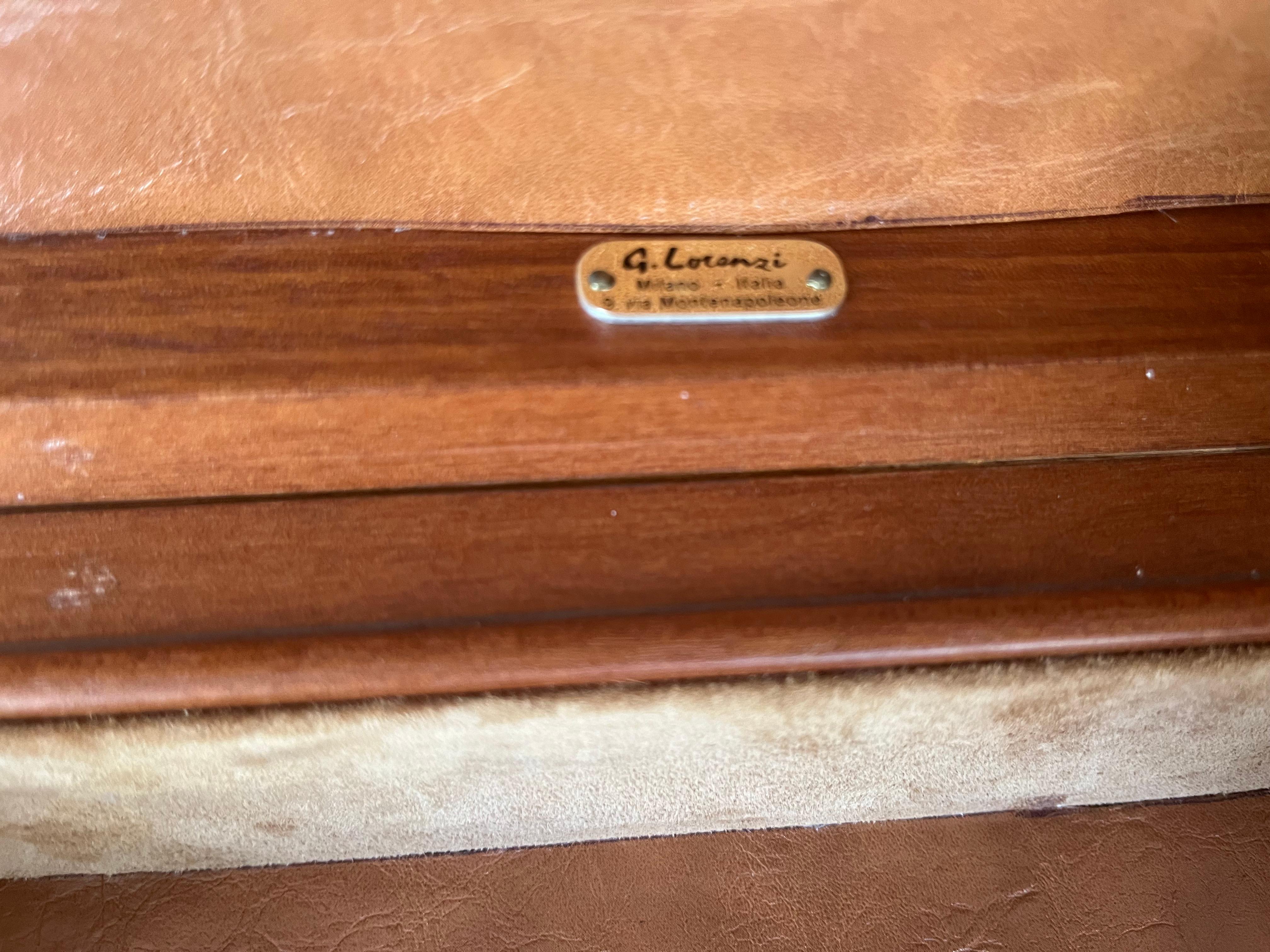 A vintage Bubinga wood box retailed by Giovanni Lorenzi-Milano having a leather interior.