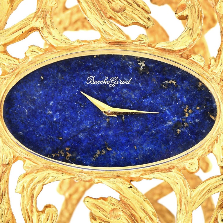 A bold Chic look from nature, with a wide floral branches design and the blue contrast of Lapiz lazuli.

From circa the 1970s, this Trending vintage 18k gold bracelet watch is crafted in solid 18K yellow gold. 

 Embellished with a center Genuine