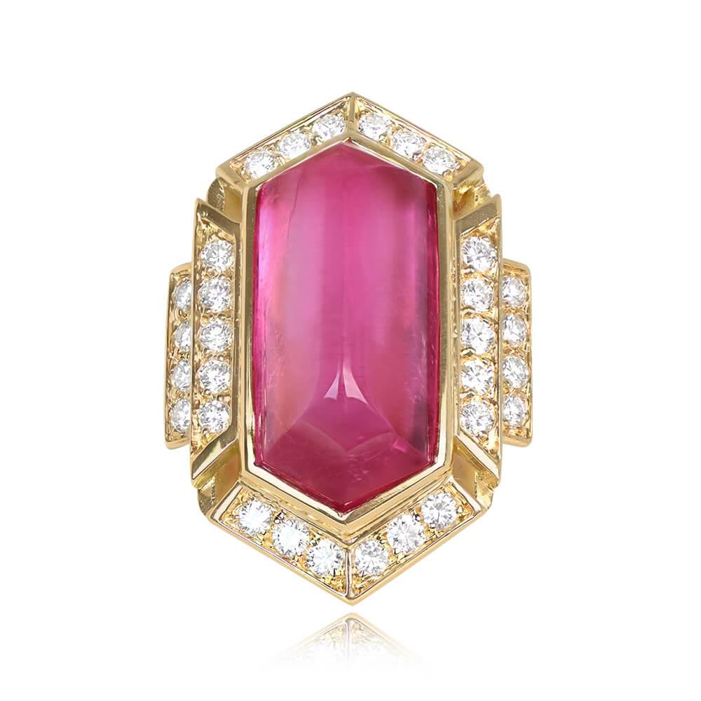 Presenting a captivating vintage Bulgari ring adorned with a sugarloaf pink tourmaline, boasting an impressive weight of approximately 17 carats. The center stone is skillfully bezel-set and encircled by a geometric halo of round brilliant cut