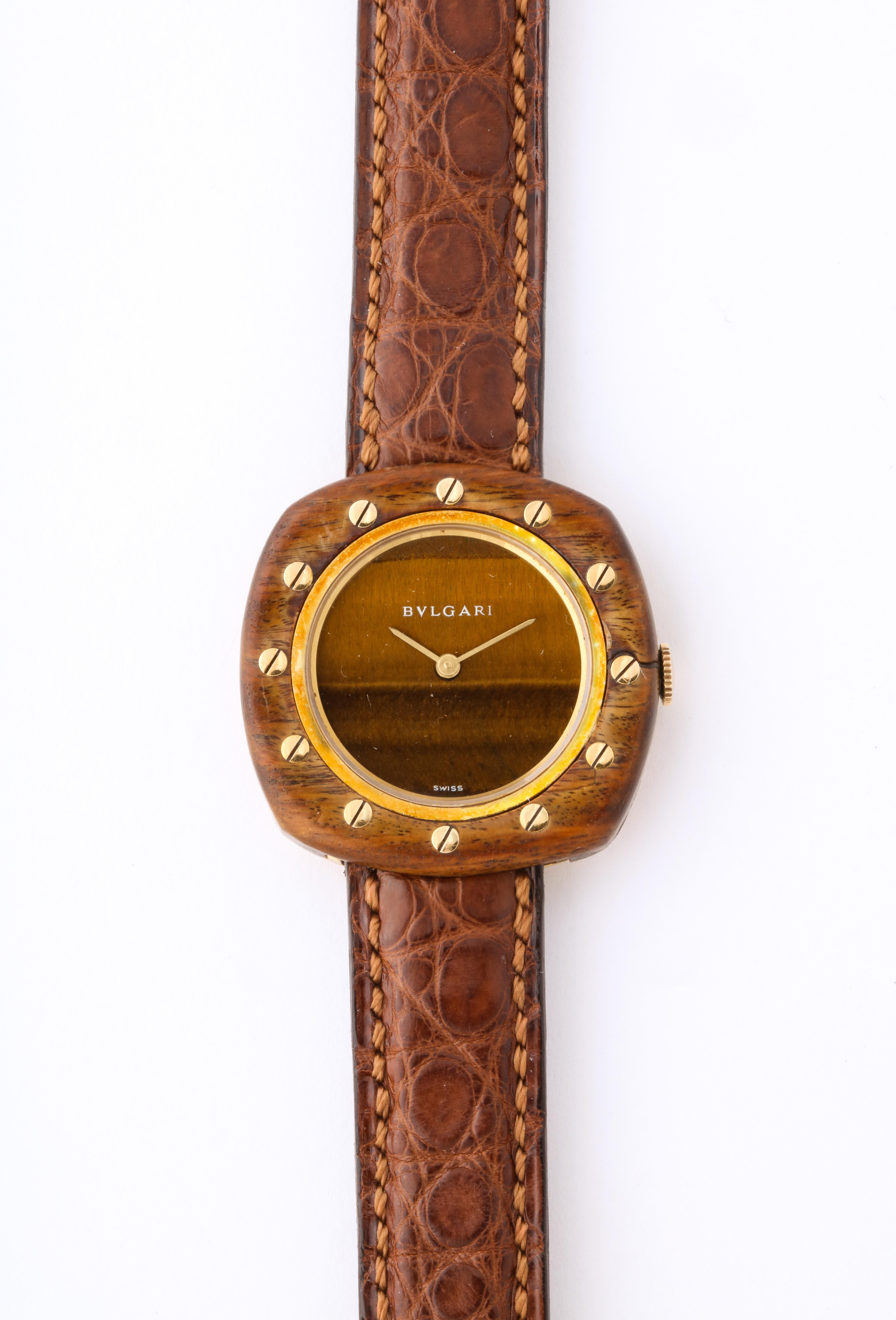 Vintage Bulgari 18K Gold and Wood Wristwatch, circa 1970.

Very unusual design with gold screws, original brown crocodile strap, marked BVLGARI.

Swiss made. Marked BVLGARI 750 to the buckle on the strap. Hallmarks and numbers to the case.  

7.5
