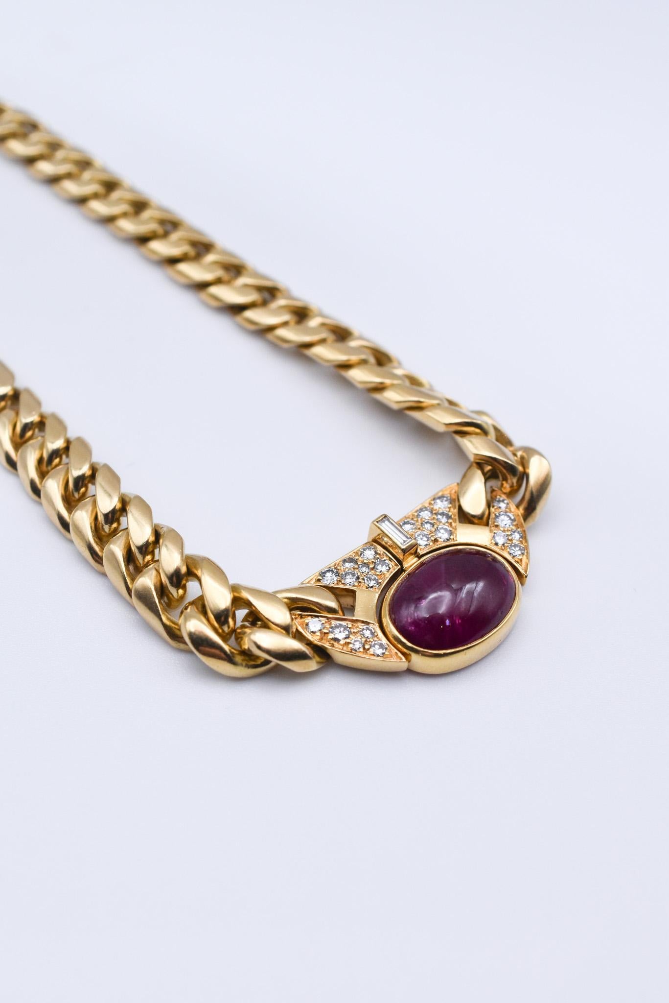 A sumptuous Bulgari Ruby and Diamond Chain Necklace in 18k Yellow Gold, showcasing an 8.00 carat Ruby framed by a total of 1.00 carat of Diamonds. 
Made in Italy, circa 1970.