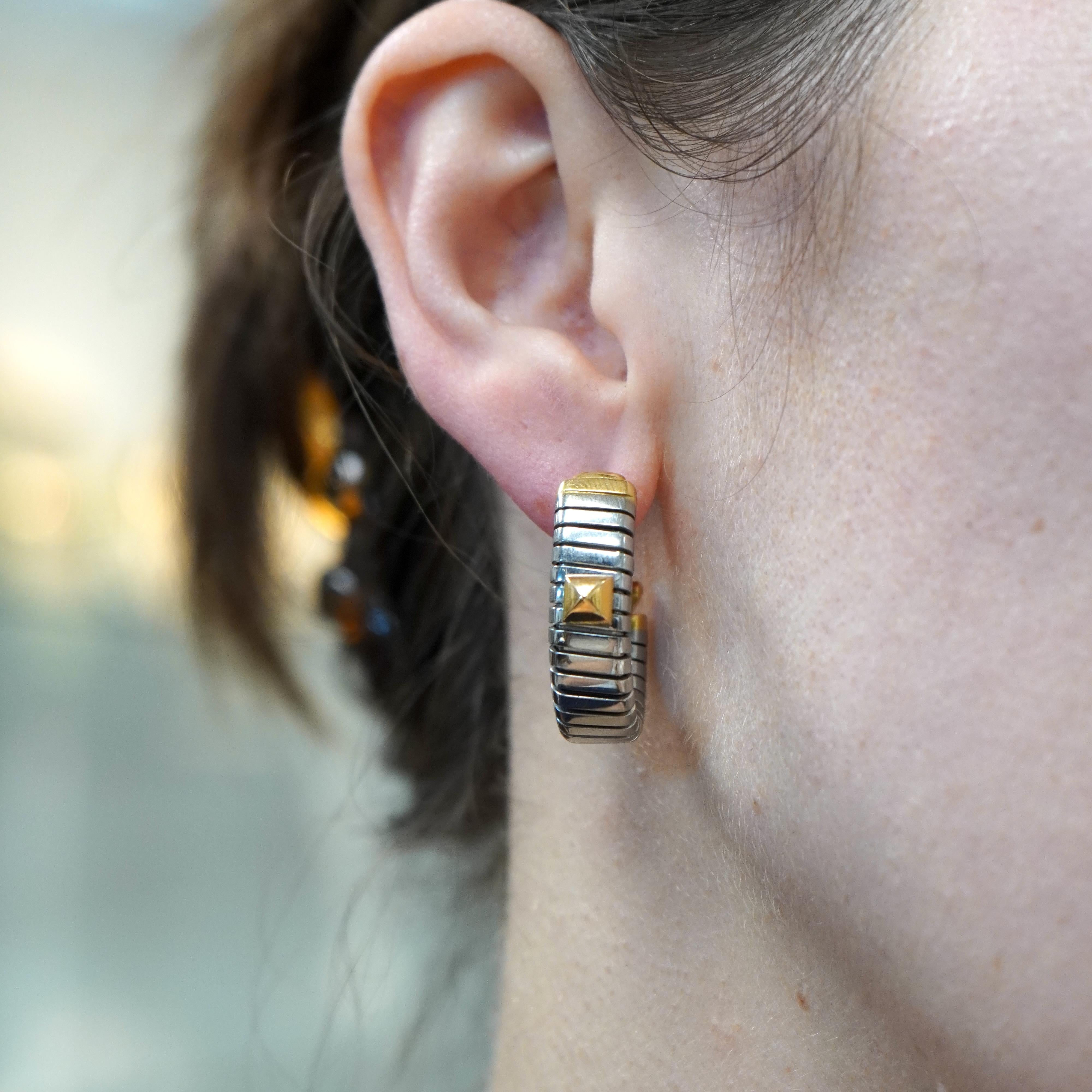 Vintage Bvlgari 18k Gold Stainless Steel Tubogas Hoop Earrings, circa 1980s. These earrings weigh 20 grams in total, their length is 1 inch and 3/8 in width, referring to how thick they are. They have posts with lever backs. Stamped Bvlgari, 750,
