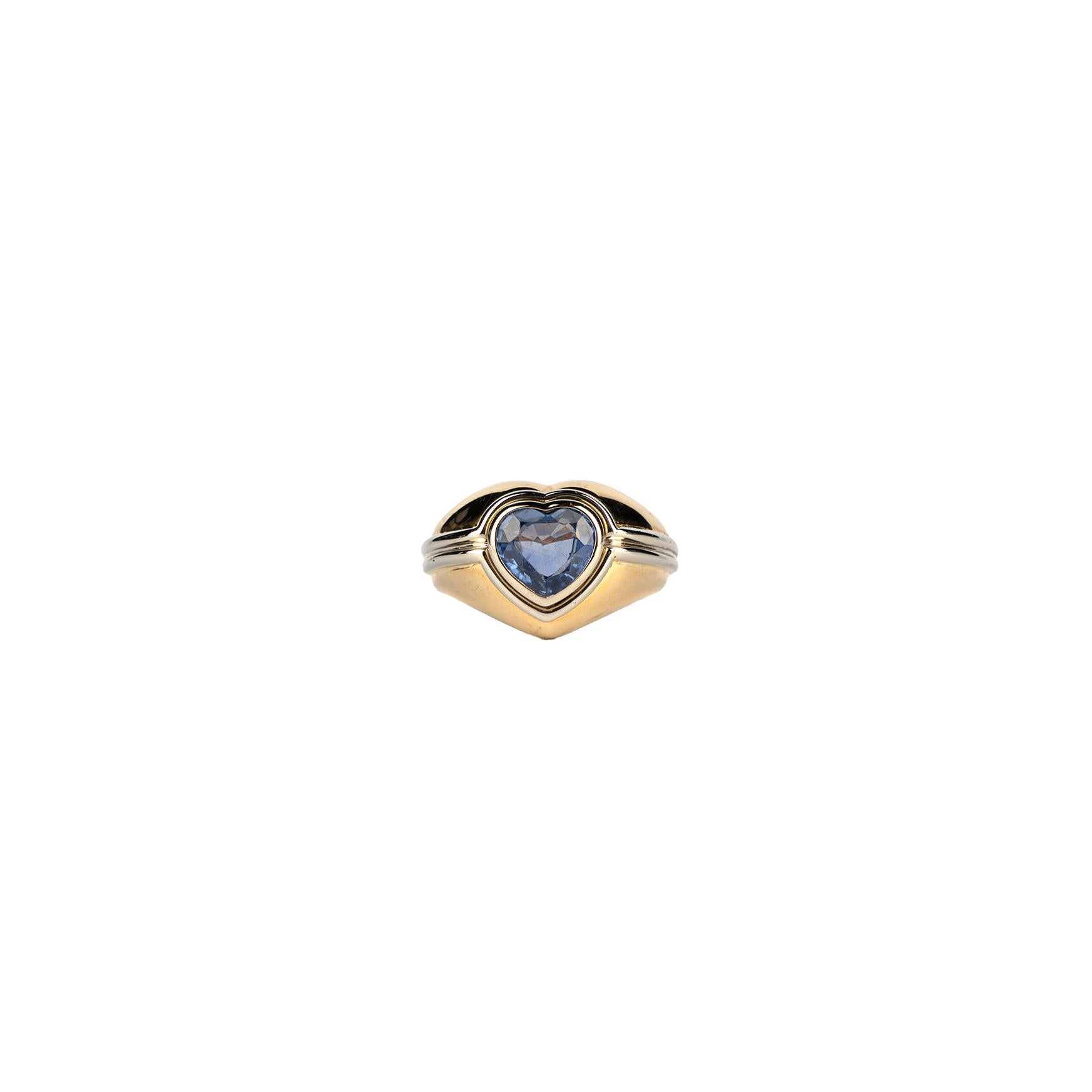 An exquisite Vintage Bulgari Sapphire Heart Ring showcasing a splendid 2.02 carat Sapphire mounted on 18k two tone gold. Made in Italy, Circa 1980.