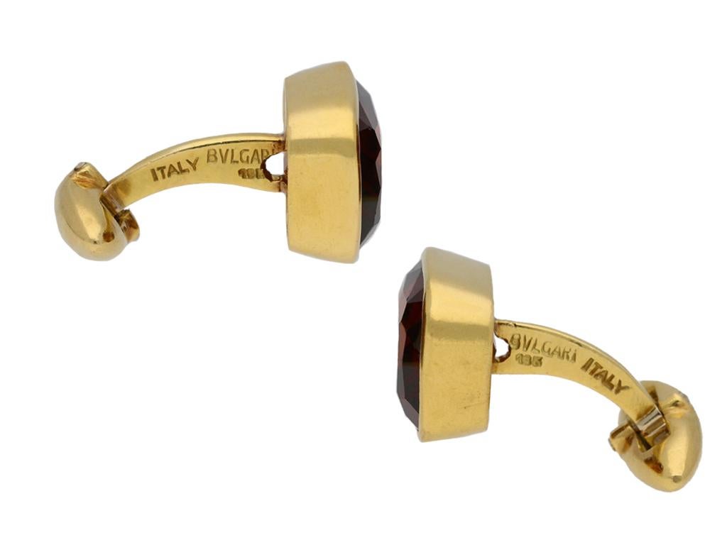 Vintage Bulgari citrine cufflinks. A matching pair of cufflinks, each composed of a cushion shape old mine natural unenhanced citrine in an open back rubover setting, two in total with a combined approximate weight of 16.00 carats, the reverse