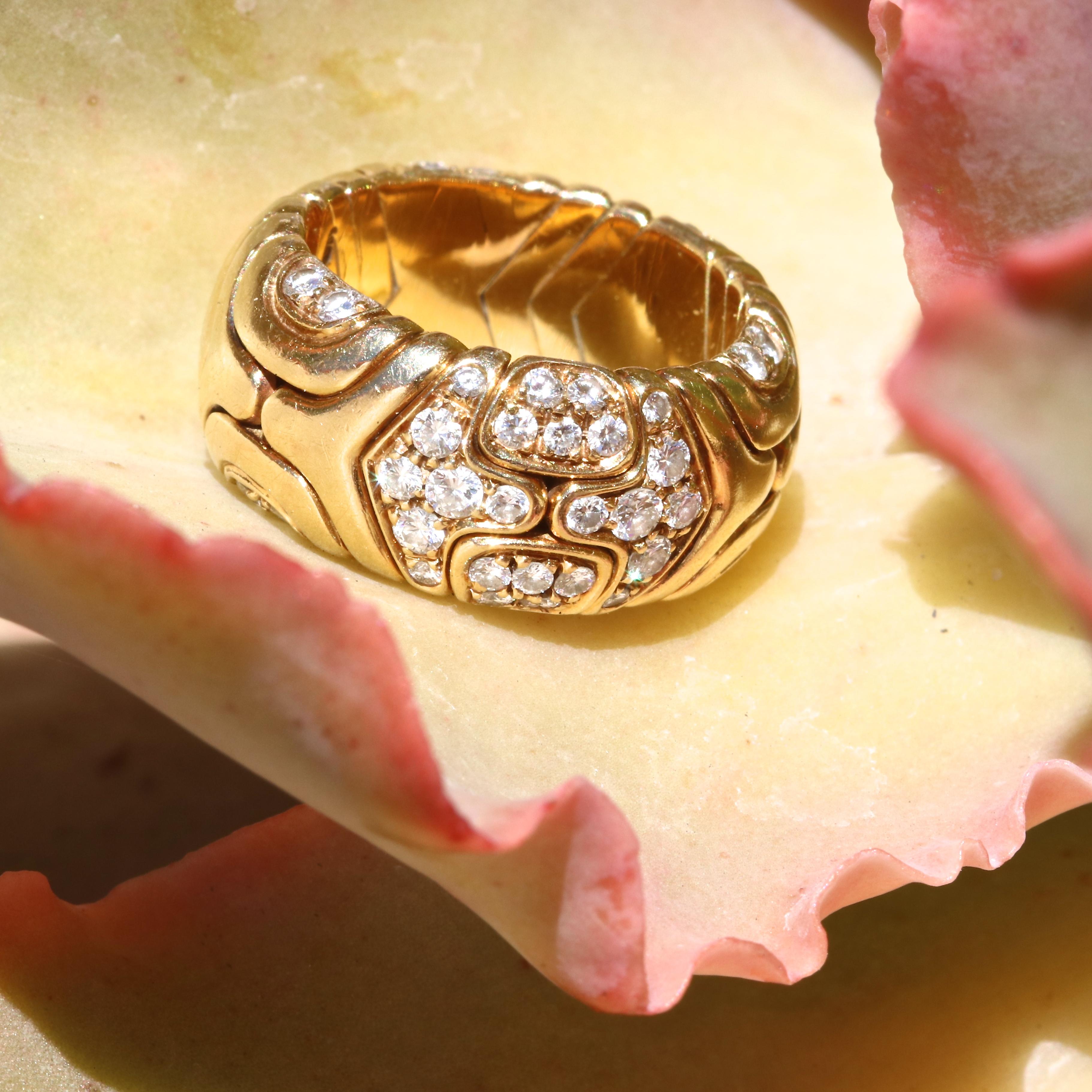 Vintage 1989 Bulgari diamond 18k ring. With 56 round brilliant diamonds that weigh approximately 1.10 carats, graded E-F color, VVS clarity. 
Jack Weir & Sons Flawless Protection Plan: 
7 day return policy for full cash refund
30 day return for