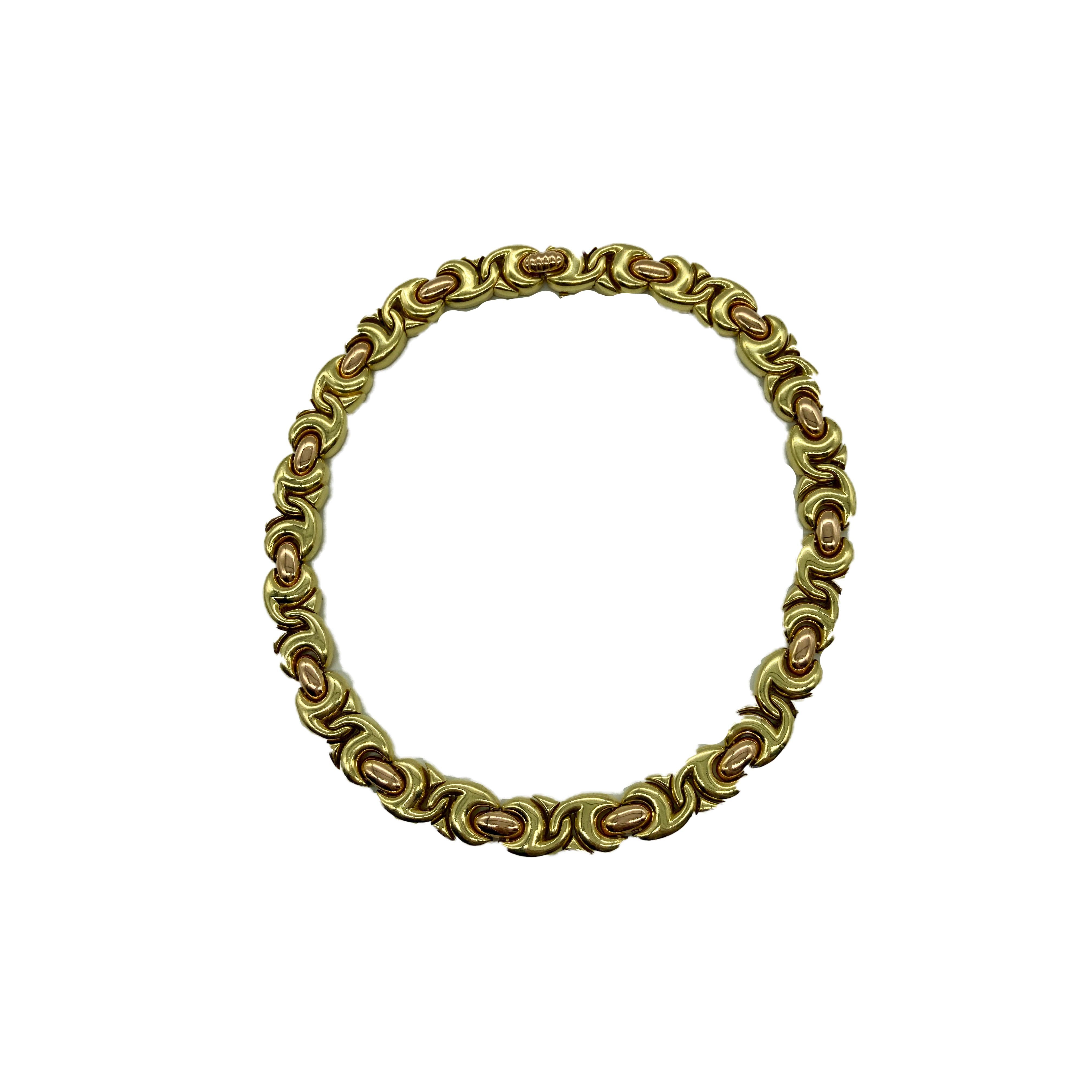 A chic Bulgari Gancio short necklace in 18 karat rose and yellow gold. Made in Italy, circa 1980s. 140 grams.
