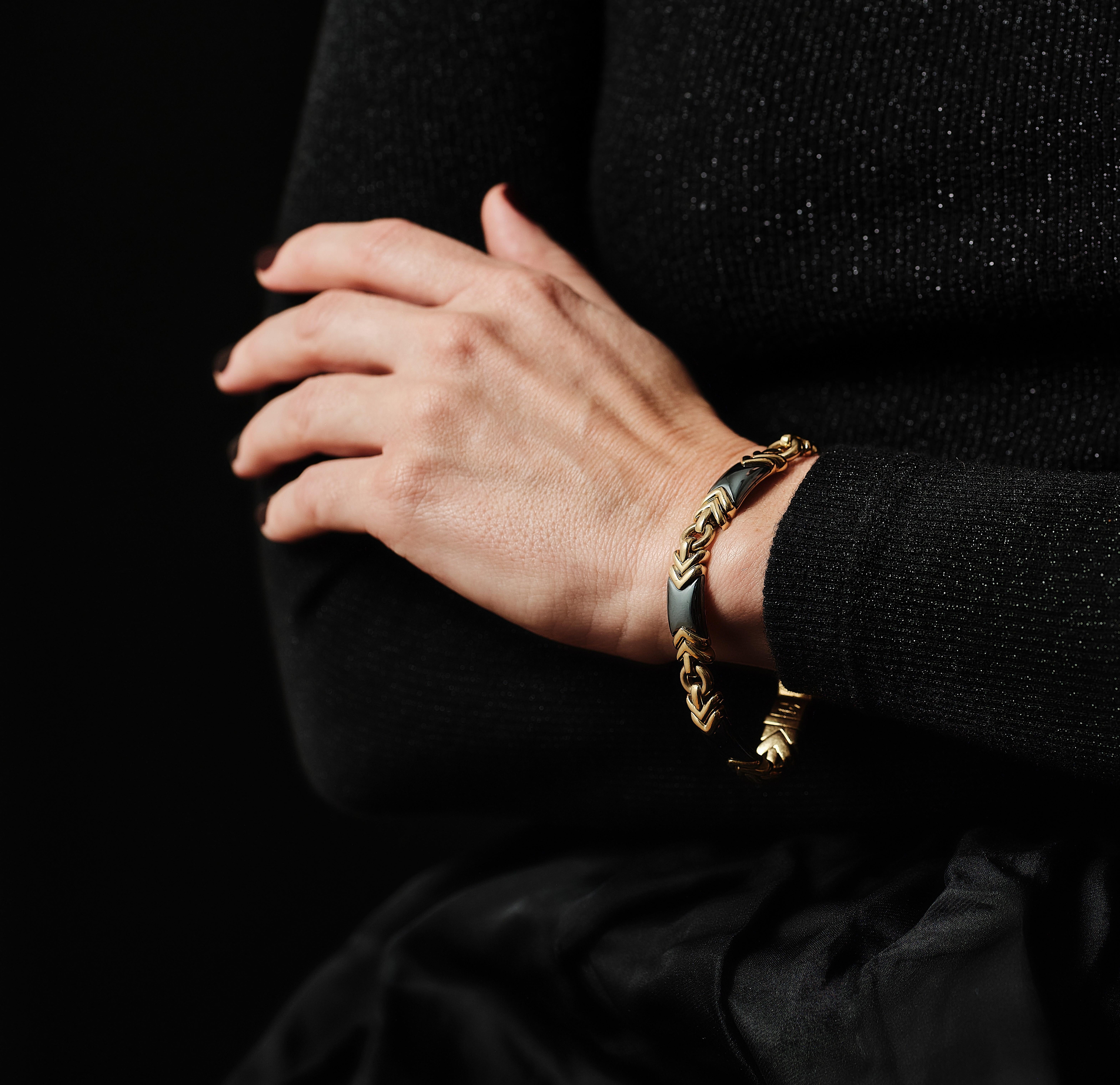 Whether you are a seasoned collector or new admirer of Bvlgari bracelets here is a perfect combo of shimmering hematite and bright 18k yellow gold that makes it stand out!

Opaque metallic dark grey in color bold yet elegant bracelet created by