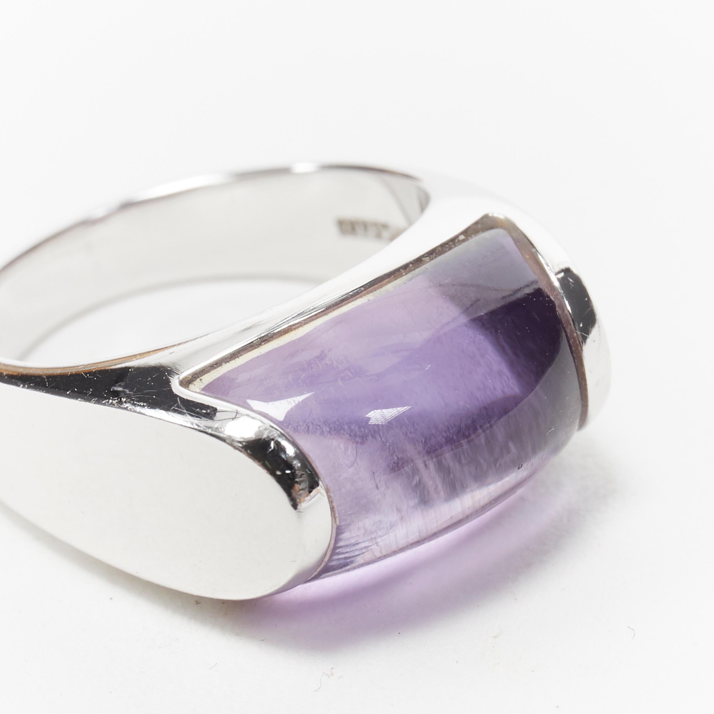 vintage BULGARI JEWELLERY Amethyst stone silver curved ring 
Reference: EHKO/A00001 
Brand: Bulgari 
Material: Silver 
Color: Silver 
Pattern: Solid 
Extra Detail: Silver with purple amethyst stone. 

CONDITION: 
Condition: Good, this item was