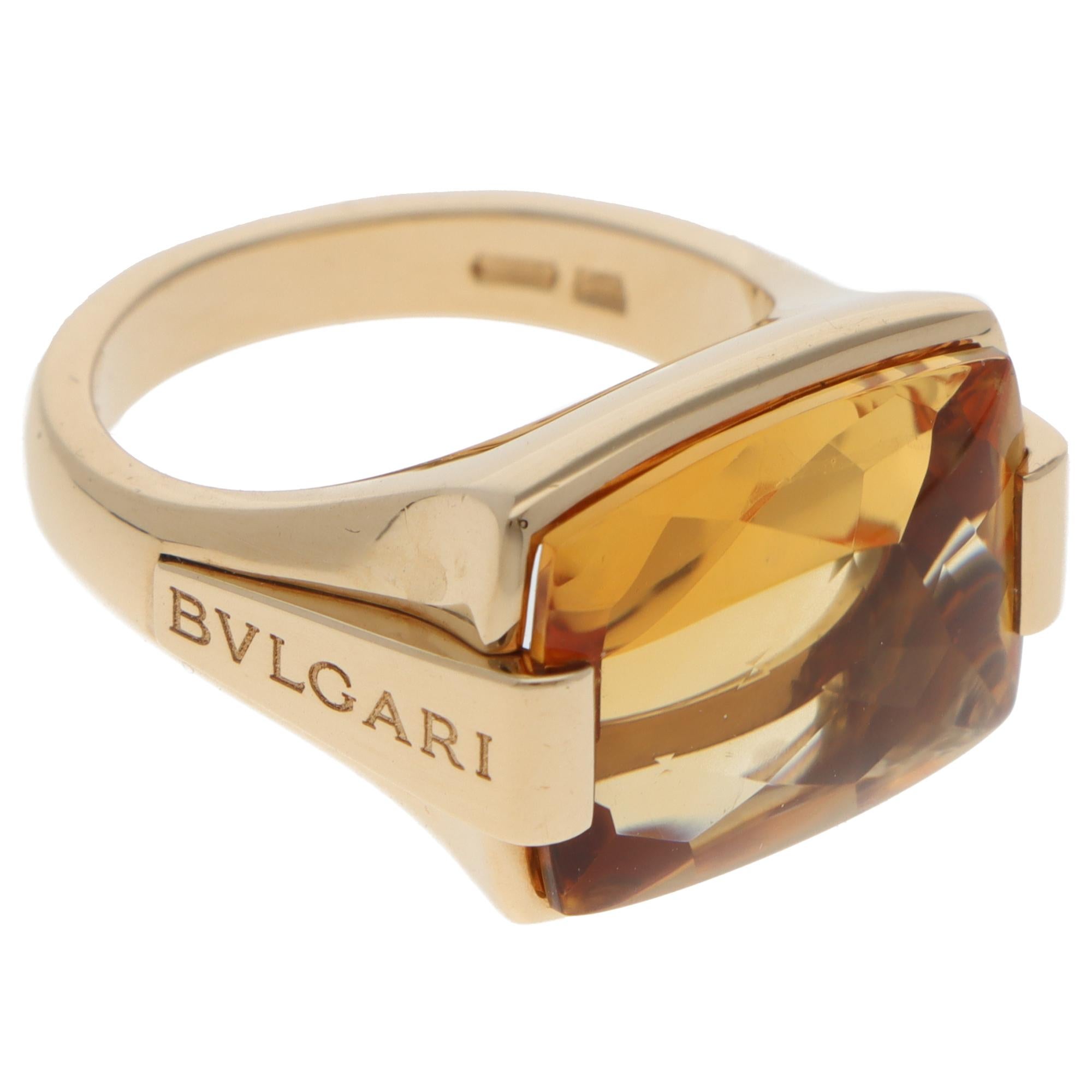 A beautiful vintage Bulgari Metropolis citrine ring set in 18k yellow gold.

From the discontinued Metropolis collection, the ring predominately features a large cushion mixed-cut citrine. The citrine is bar set securely in polished yellow gold with