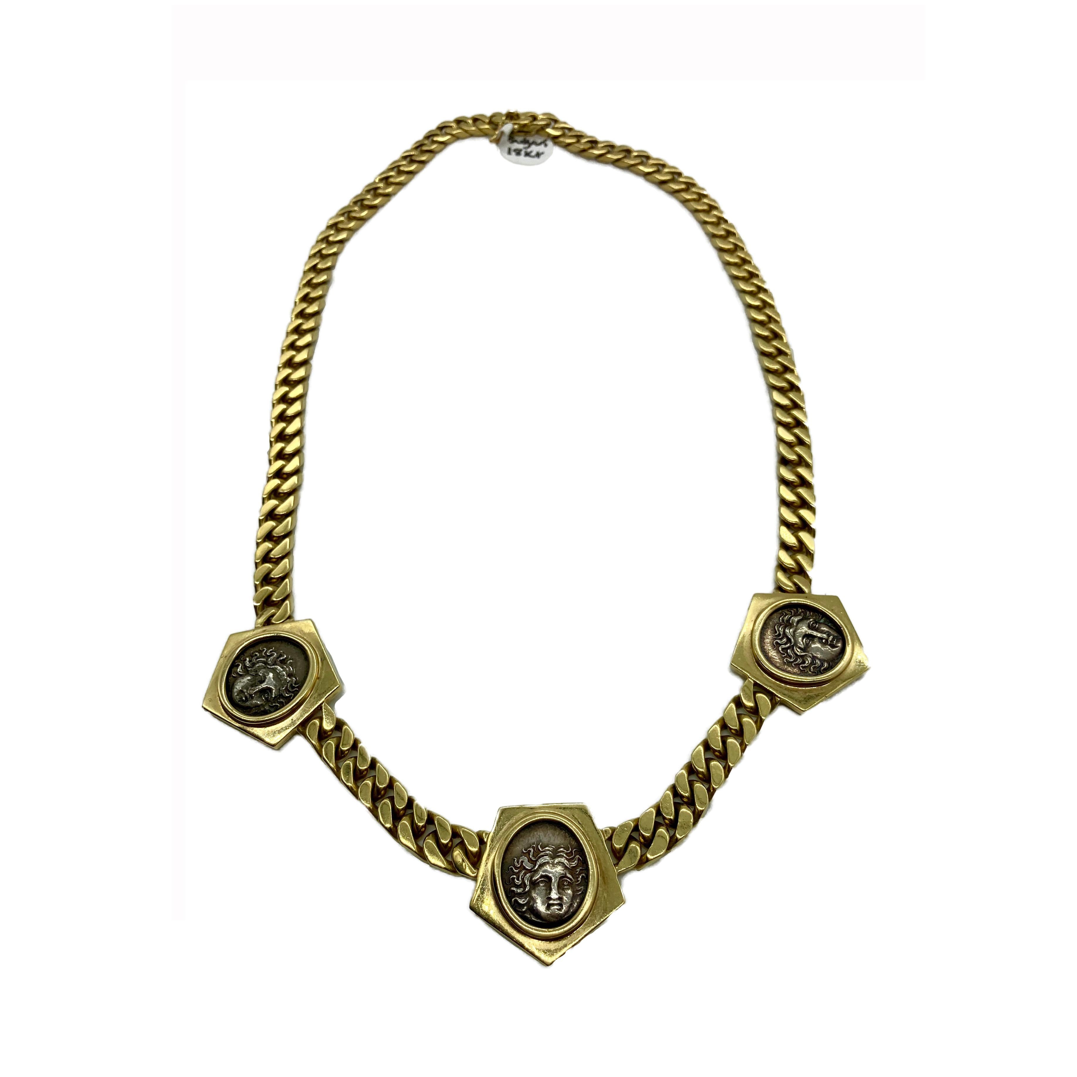 A chic vintage Bulgari Monete 18 karat yellow gold curb link chain necklace suspending 3 Ancient Greek coins. Made in Italy, circa 1970s. 