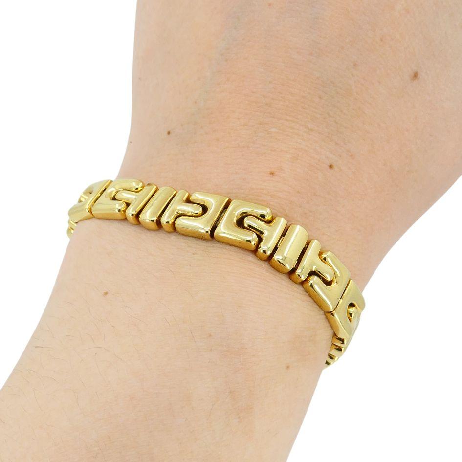 This Bvlgari bracelet from the Parentesi collection, crafted in the 1980s, is made of 18k gold and weighs 67.3 grams. Measuring 7 inches in length and 3/8 inch in width, the bracelet features a repeating geometric pattern inspired by Roman