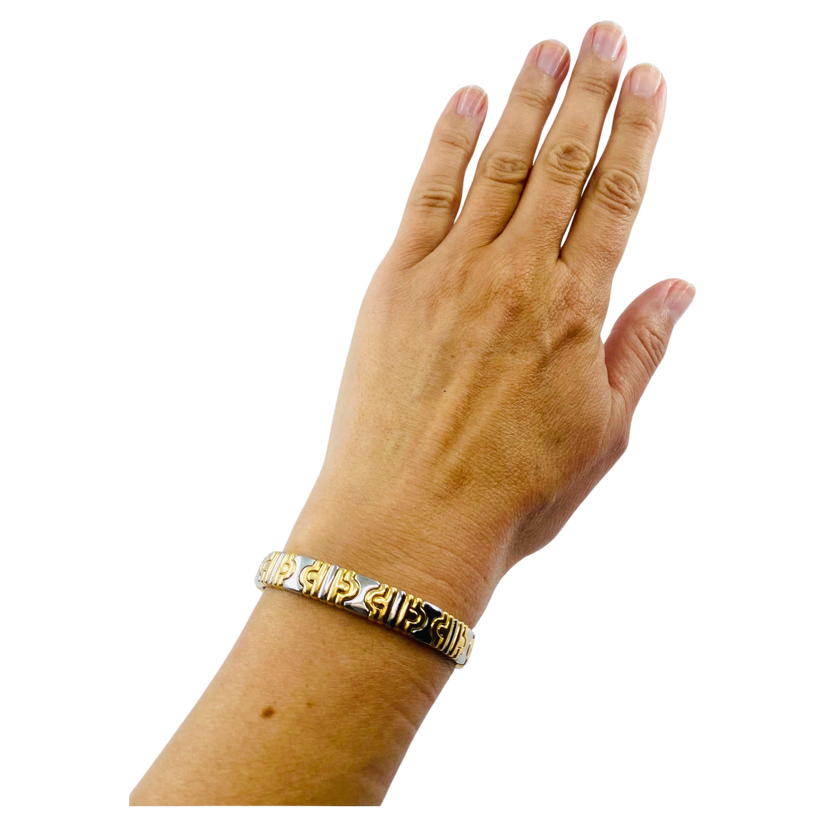 DESIGNER: Bulgari
CIRCA: 1990’s
MATERIALS: 18K Yellow Gold & Stainless Steel
WEIGHT:  33.3 grams
MEASUREMENTS: 6” inner circumference x 5/16”
HALLMARKS: BVLGARI, 750


ITEM DETAILS:
A classic Bulgari bracelet from the Parentesi collection made of