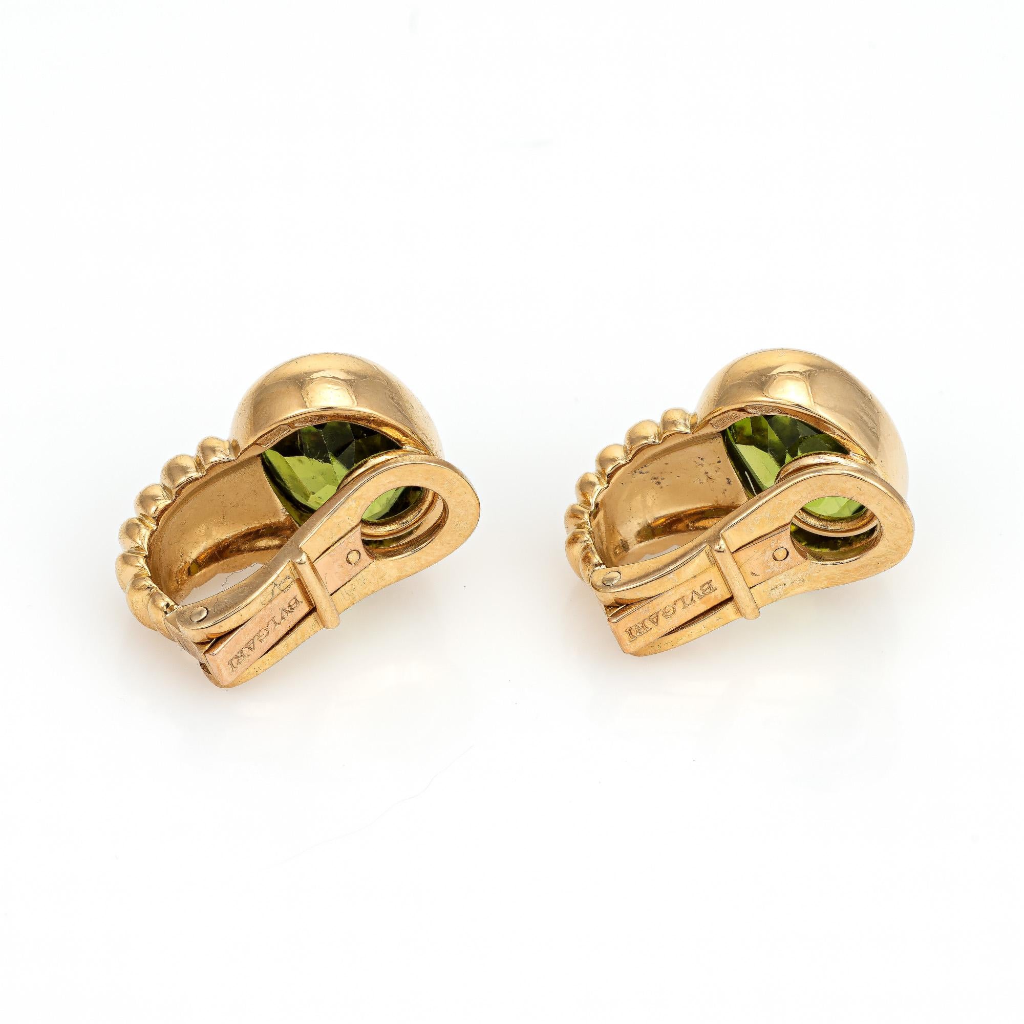 Finely detailed pair of vintage Bulgari peridot earrings (circa 1980s) crafted in 18k yellow gold. 

Faceted oval cut peridot measures 10mm x 8mm (estimated at 2.75 carats each - 5.50 carats total estimated weight). They are in good condition and