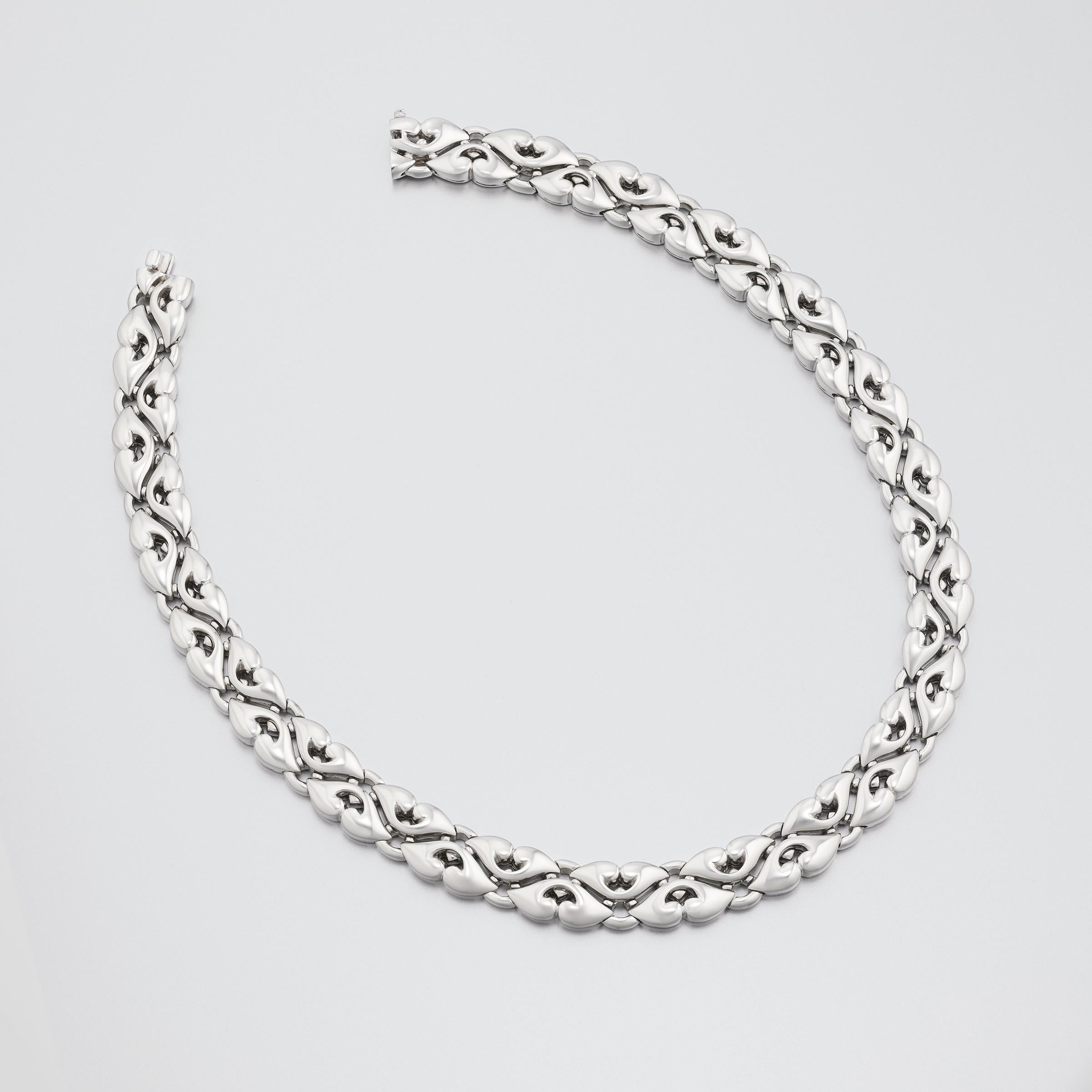 Luminous vintage Bulgari necklace exceptionally crafted in solid 18 karat white gold. The necklace is sumptuous with lavish width of over half an inch (13mm) and substantial weight (approximately 165 grams). Intricately designed polished white-gold
