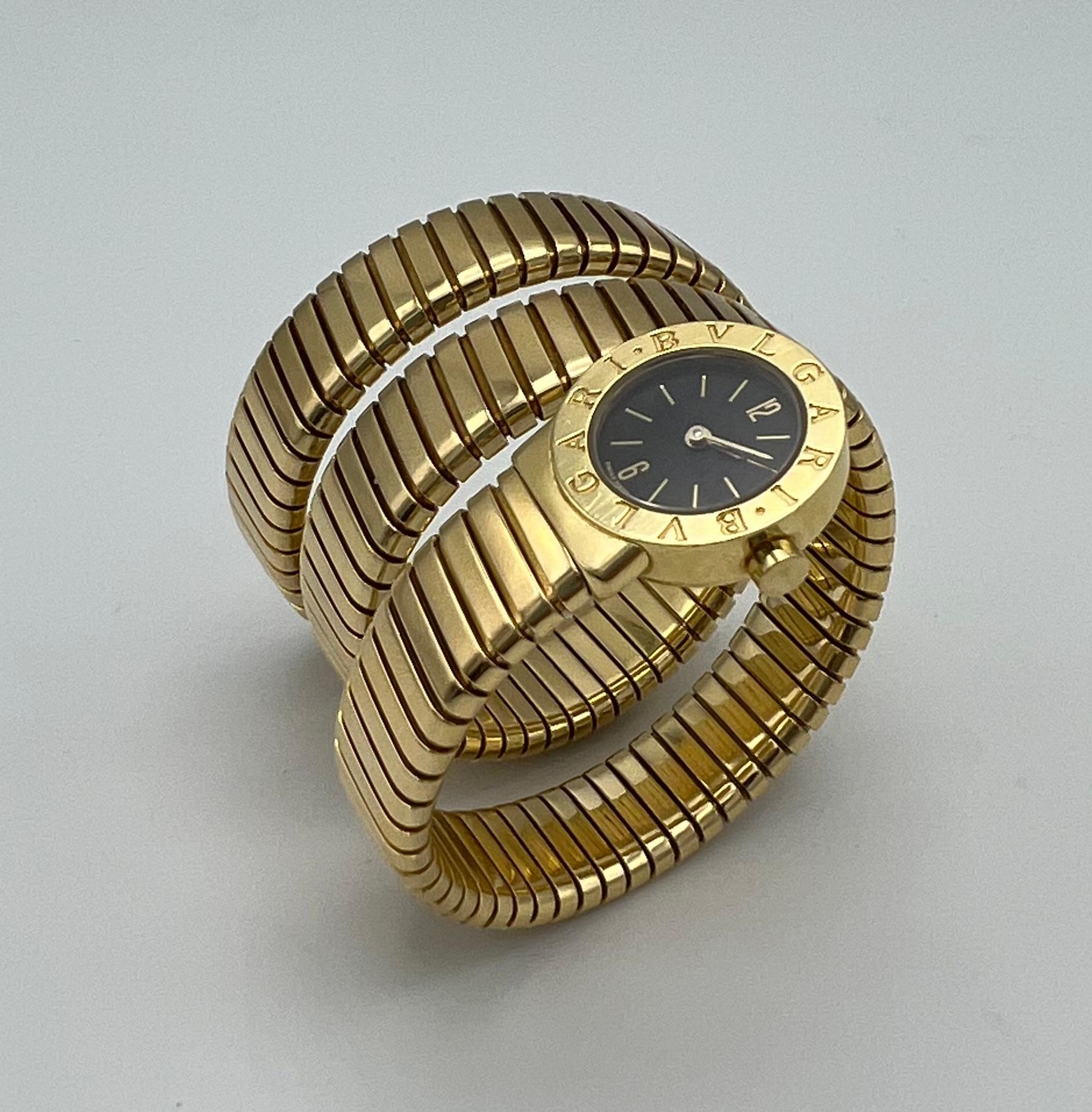 Product details:  

The watch is made out of 18K yellow gold. It features quartz movement, 19mm case diameter, engraved bezel and wrap around design. The watch comes with the original fitted box. The watch fits smaller wrist.   
Hallmarks: BVLGARI