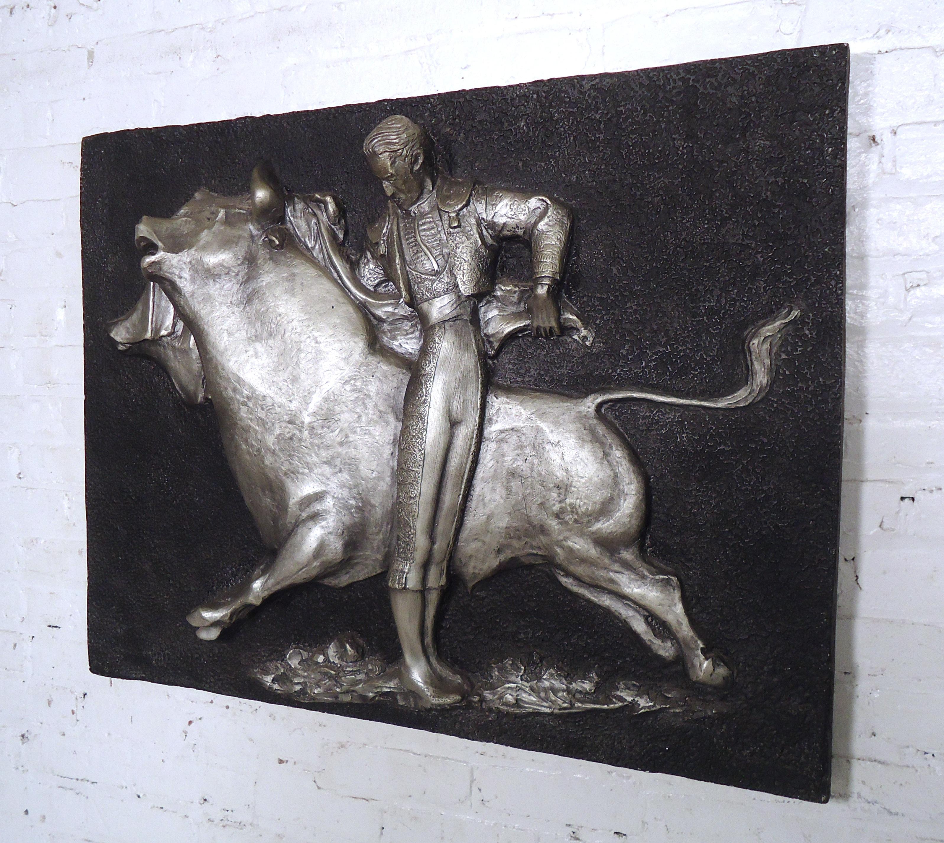 Fascinating molded fiberglass bull fight by renowned mid-century artist J. Segura. A three dimensional casting jumps off the wall and adds a vivid sense of adventure and excitement to any room. Blends traditional, retro, and brutalist aesthetics