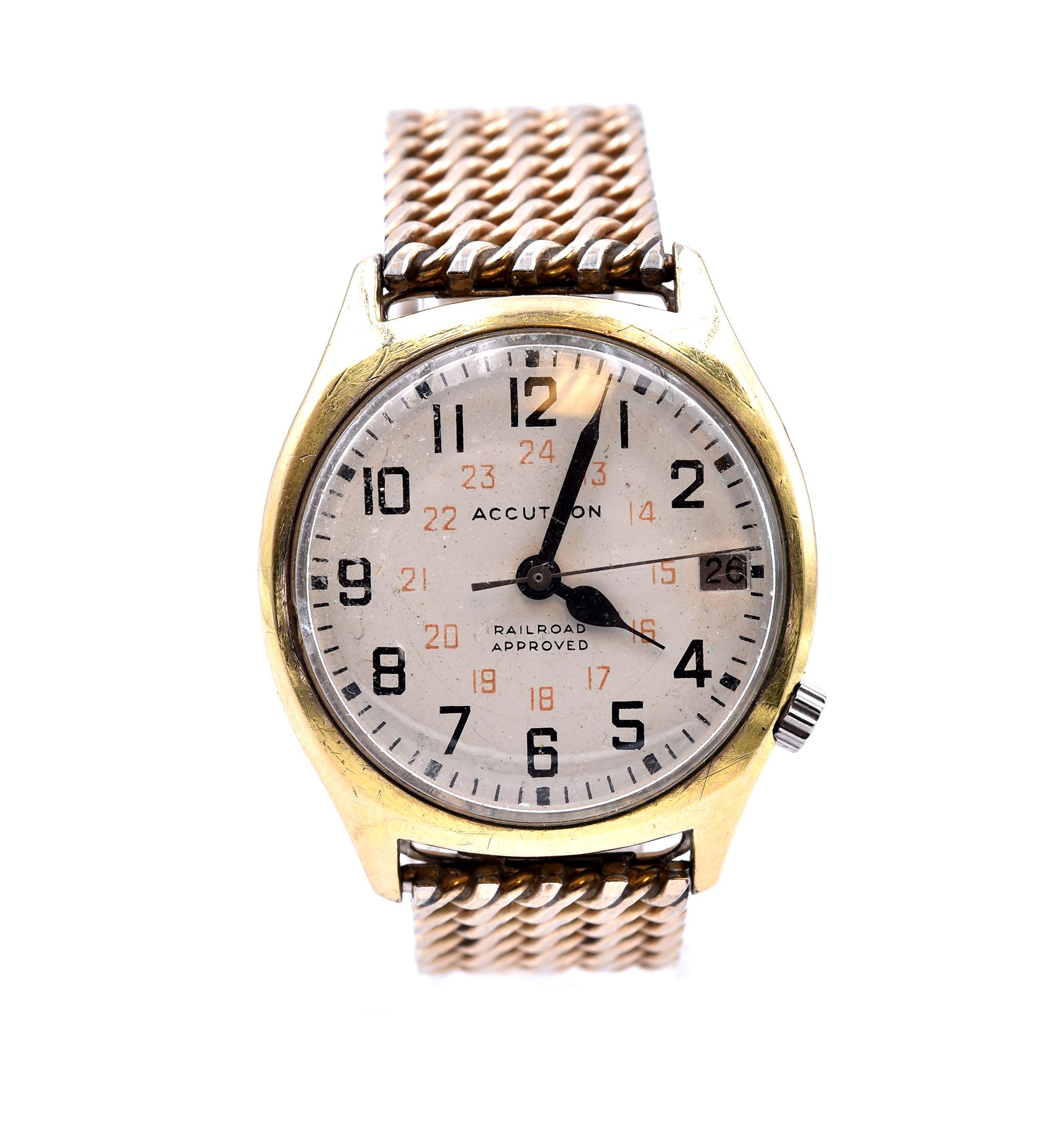 Movement: quartz  
Function: hours, minutes, seconds, date
Case: round 34mm stainless steel gold-plate case with plastic crystal, fixed steel gold-tone bezel, pull/push crown
Band: stainless steel gold-tone bracelet, bracelet is 6 ½-inch wrist
Dial: