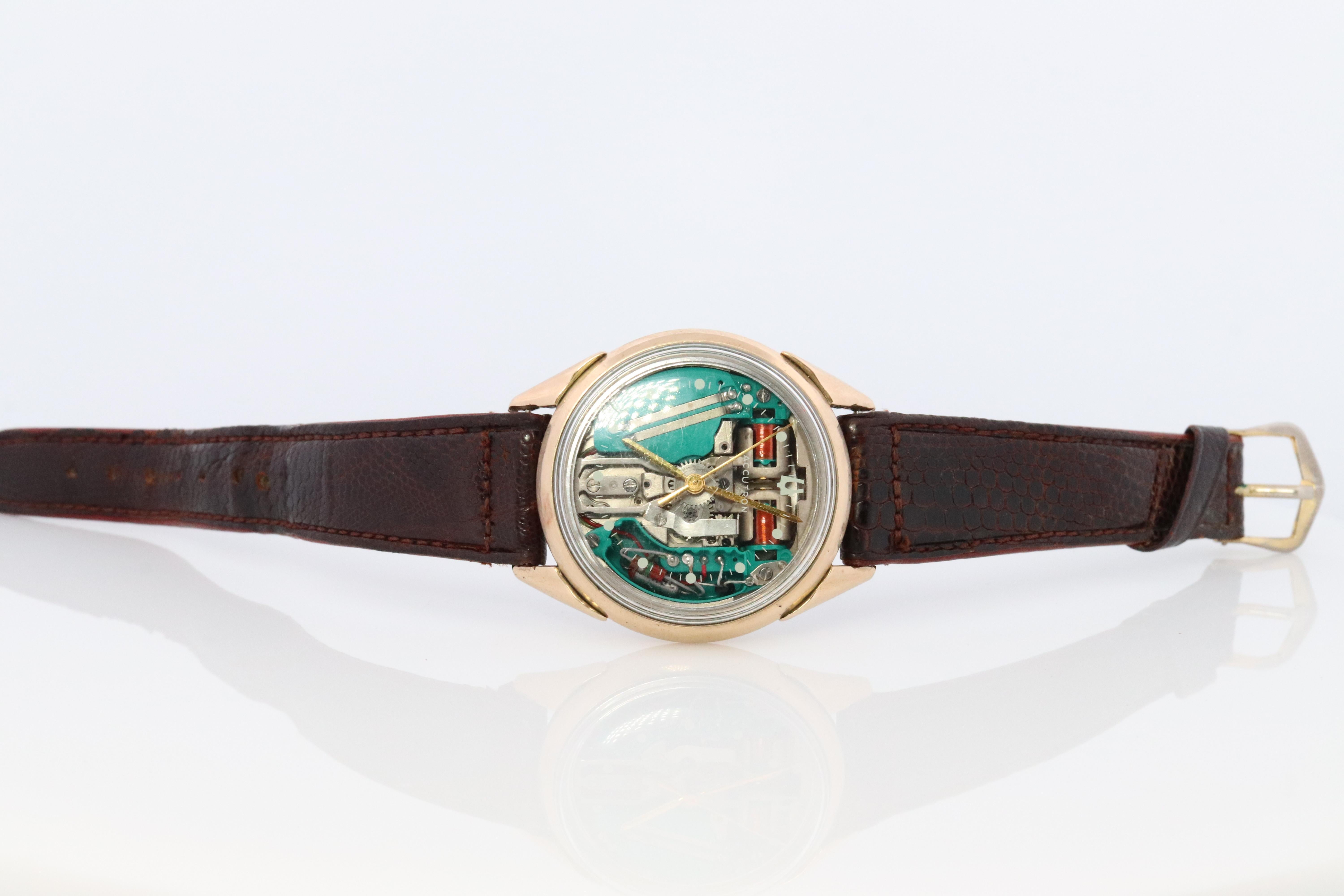 Extremely Rare Bulova Accutron Spaceview Watch

Transparent Dial.

Ref. M2
H41369

35mm Round Case
10k Gold Filled case.

Condition. Works and Keeps time accurately. When you set the watch it sticks, need to pull the handle while adjusting the hands.
