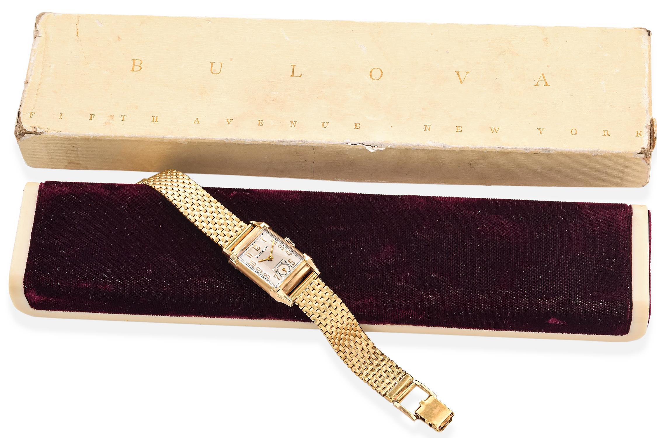 A vintage Art Deco Bulova rectangular watch with Kreisler bracelet features a manual movement and a 12-hour dial.
Watch is in good condition, running well.

Case Size: 28.45 x 21 mm
Band Length: 7 Inches
Hallmark: Bulova, Kreisler 10K GF

ITEM #: