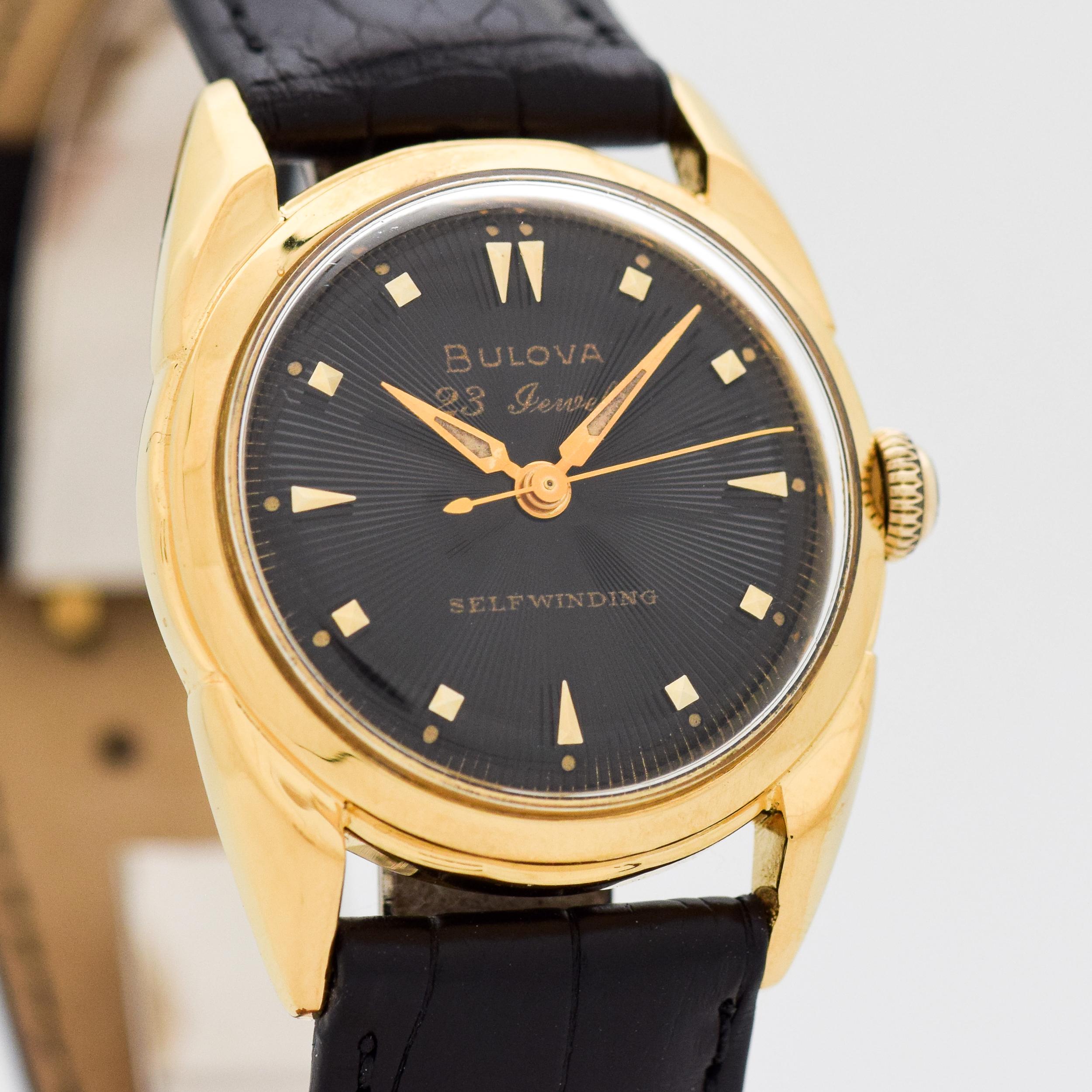 1956 Vintage Bulova 10k Yellow Gold Filled with Stainless Steel Case Back watch with Original Black Dial with Attached Gold Color Beveled Square and Elongated Arrow Markers. 30mm x 38mm lug to lug (1.18 in. x 1.5 in.) - 23 jewel, automatic caliber