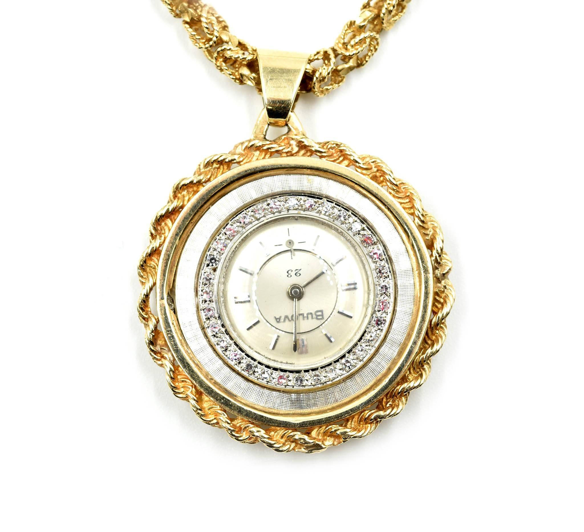 Movement: manual wind  
Function: hours, minutes, sub seconds
Case: round 39mm stainless steel case with 14k yellow gold rope chain bezel, diamonds set around plastic crystal, pull/push crown
Diamonds: 32 round brilliant cuts = 0.48 carat total