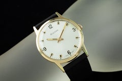 Vintage Bulova Gold-Plated Dress Watch with Black Leather Band.