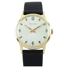 Vintage Bulova Gold-Plated Dress Watch with Black Leather Band.