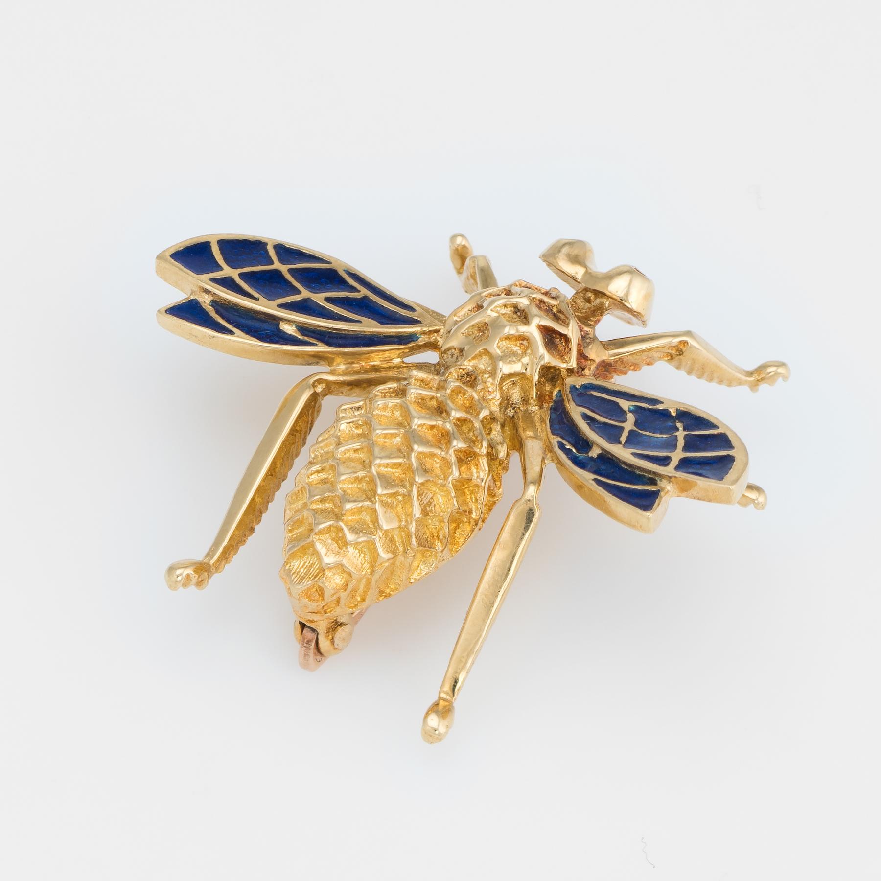 Finely detailed vintage brooch, crafted in 14 karat yellow gold. 

Blue enamel is set into the bees wings adding color and contrast to the piece. The body of the bee features a graduated honeycomb like texture.  

The brooch is in excellent original