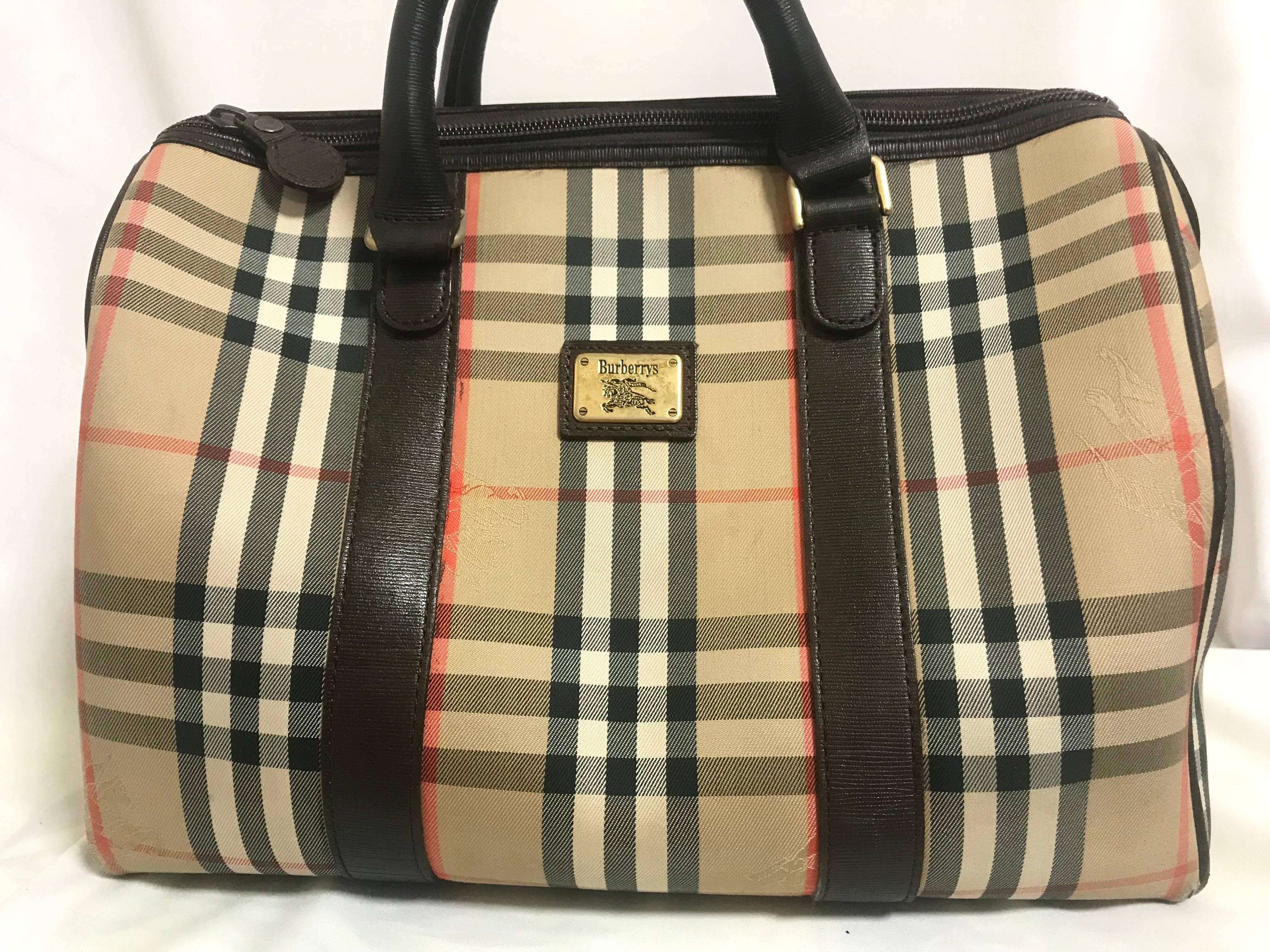 1980s. Vintage Burberry classic beige and brown nova check handbag with leather trimmings. Burberrys must have bag. Unisex.

Classic style that would never go out of style!
This is a Burberry vintage handbag with the traditional and iconic nova