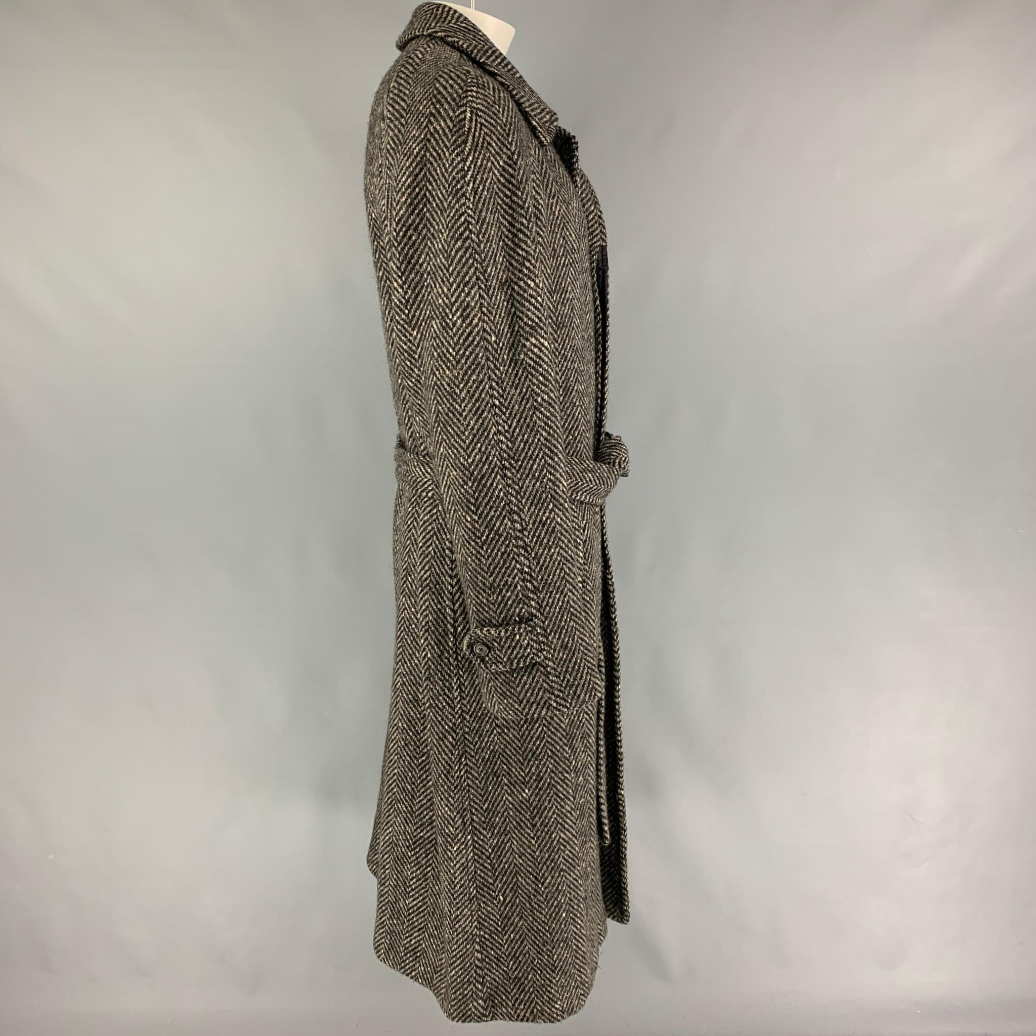 Vintage BURBERRYS for BARNEY'S NEW YORK coat comes in a black & grey herringbone wool with a full liner featuring a notch lapel, belted style, slit pockets, and back vent, and a buttoned closure. Made in USA. 

Very Good Pre-Owned Condition.
Marked: