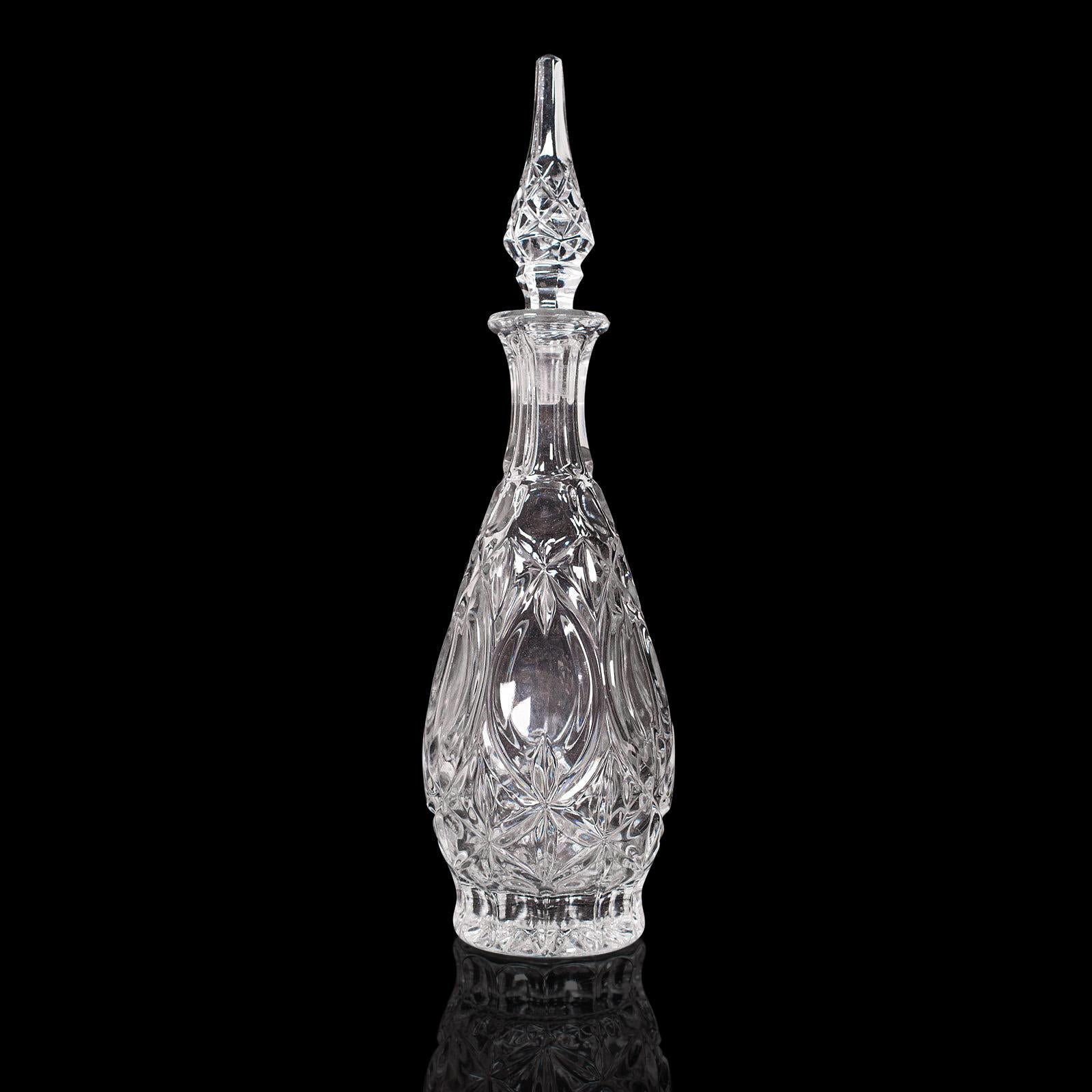 This is a vintage burgundy decanter. A French, cut glass wine vessel in Art Deco taste, dating to the mid 20th century, circa 1950.

Elegant decanter with ornate Art Deco detail
Displays a desirable aged patina and in good order
Quality cut