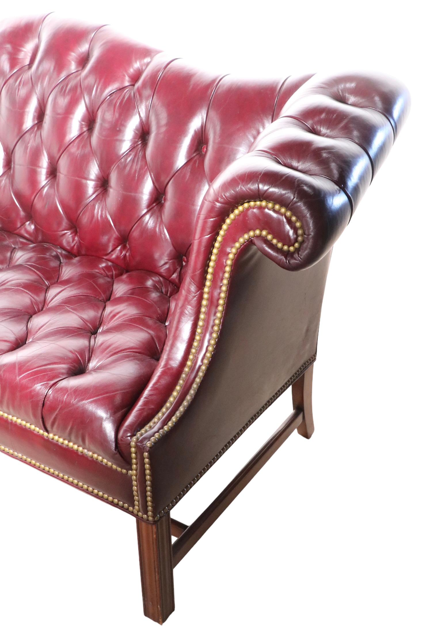 American Vintage Burgundy Leather Chesterfield Sofa with Brass Nail Head Stud Trim