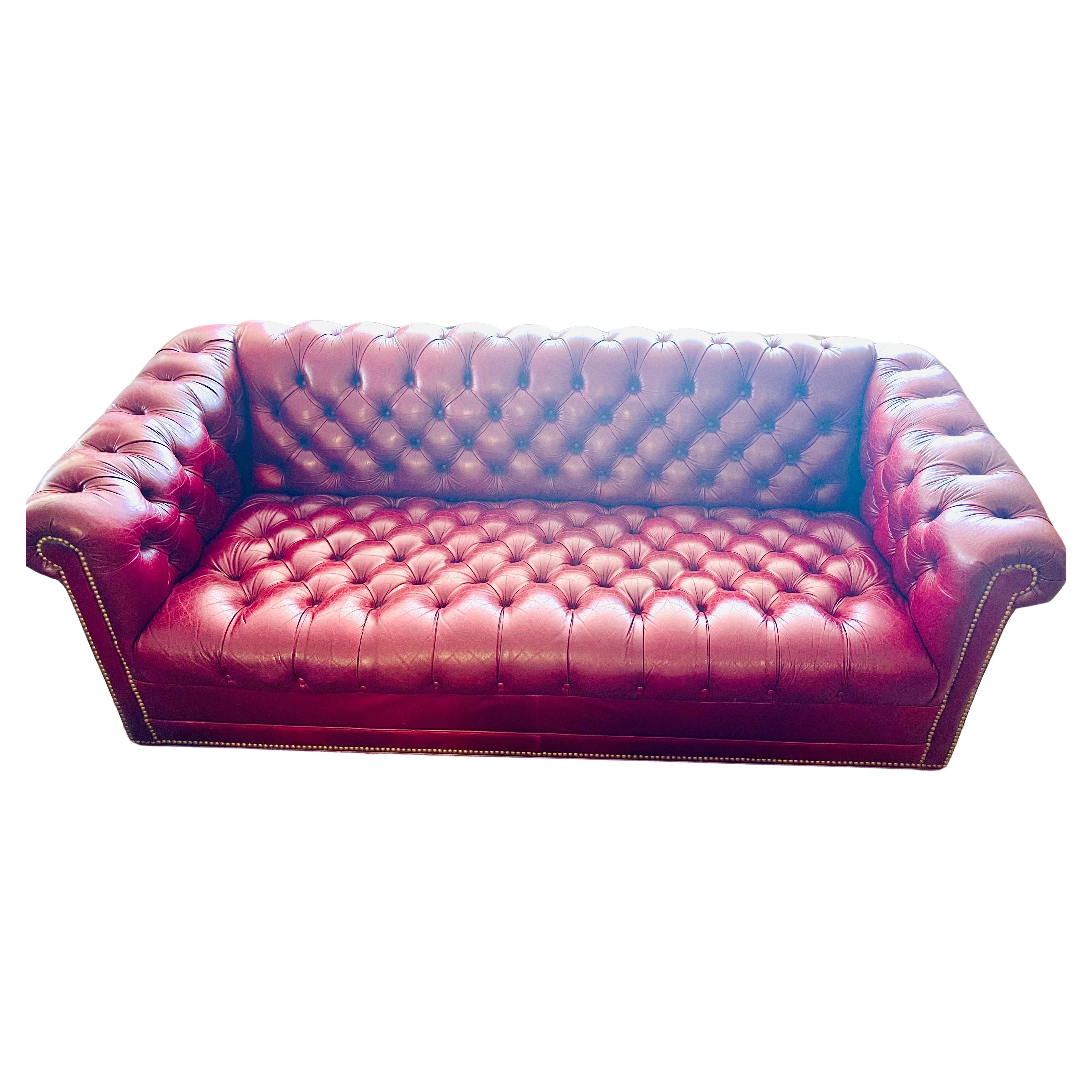 Vintage chesterfield tufted leather sofa with nailheads. The leather has been broken in well and the patina is beautiful - please see pics. Do note that there is some slight wear to the leather but that it only makes the piece even more special.