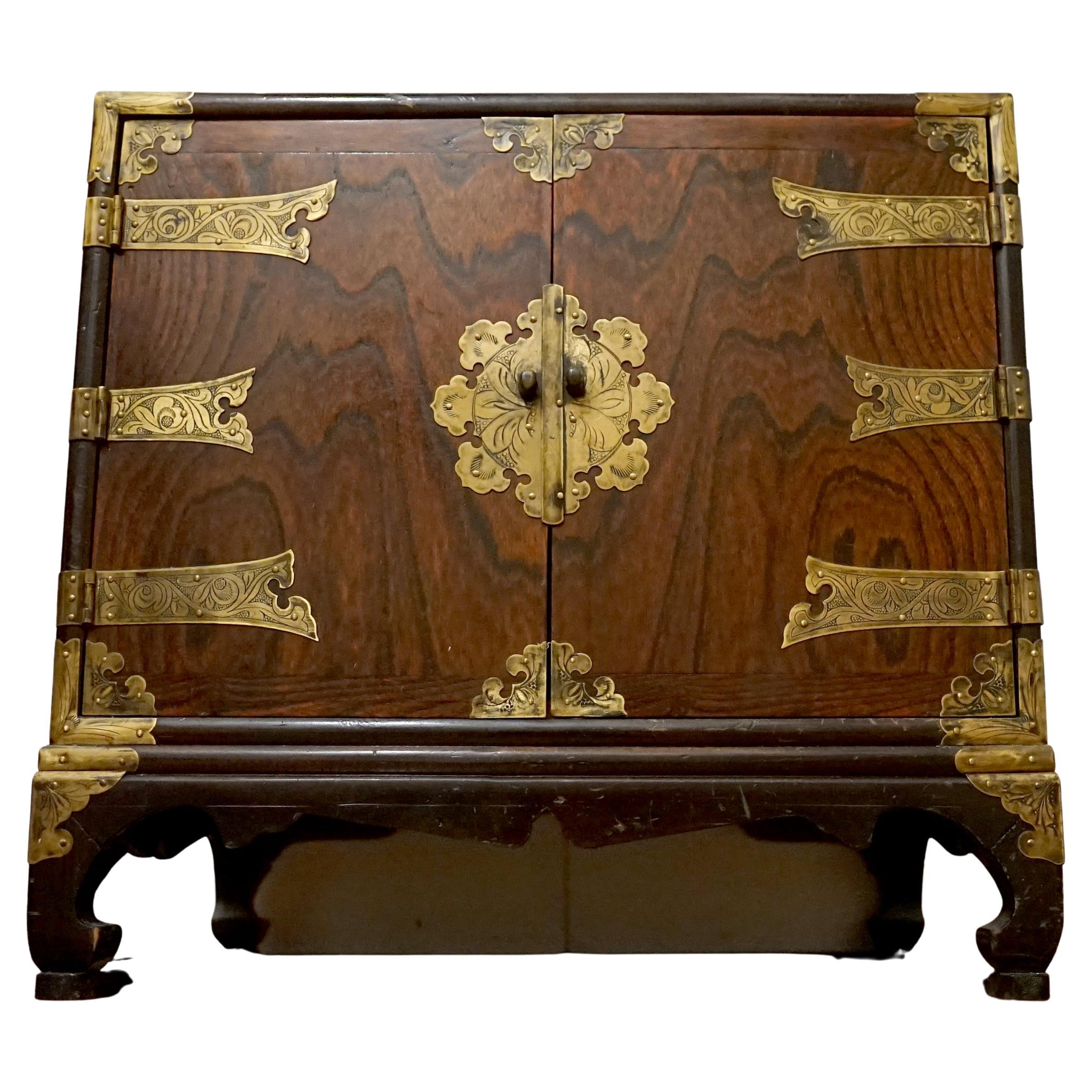 This is a unique Japanese Tansu chest that presents beautifully and also offers a glimpse into history through its design. The inside of the cabinet and the back side are covered in Chinese calligraphy that retraces conflict between the private