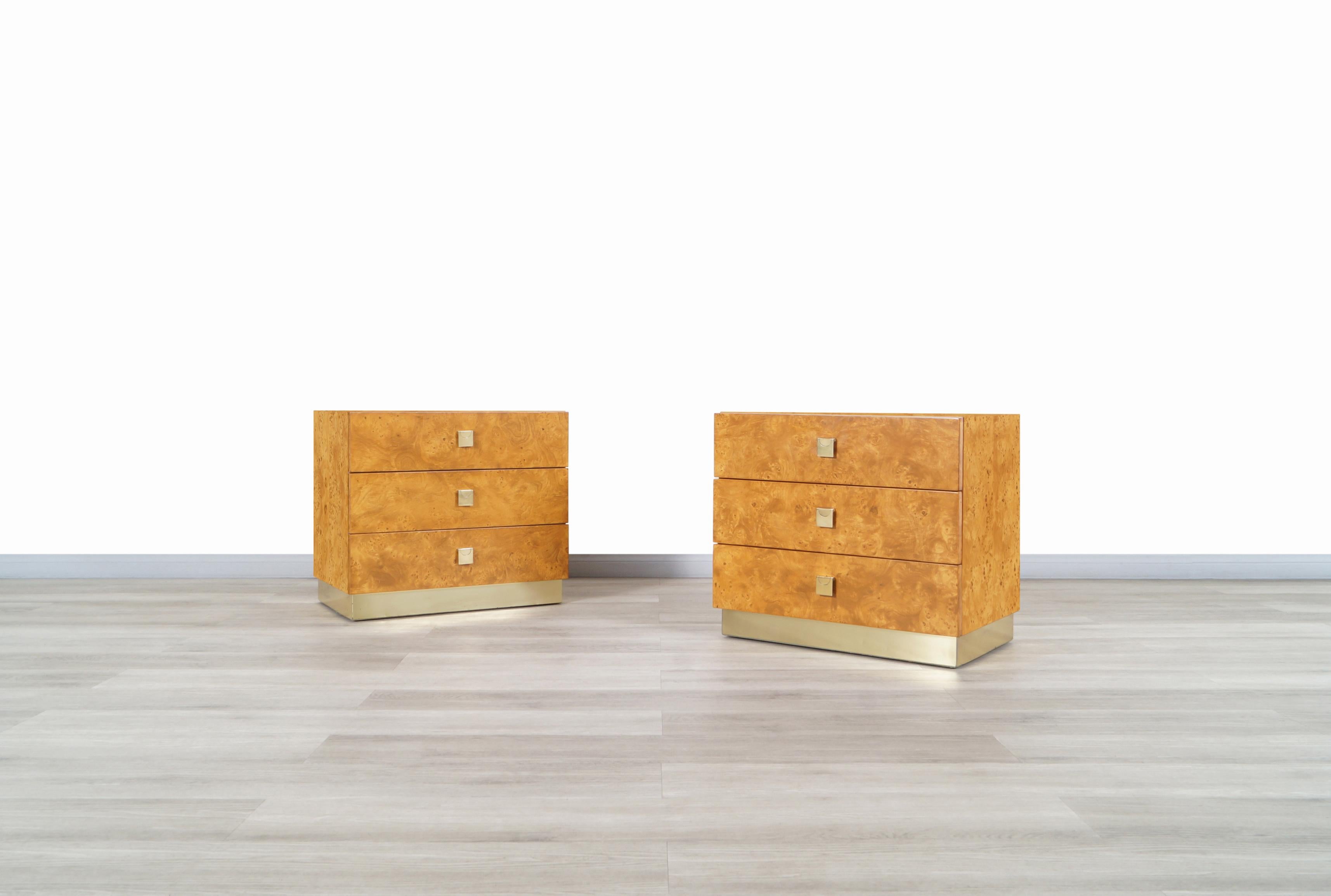 Gorgeous vintage burl wood and brass chest of drawers / nightstands manufactured by Founder in the United States, circa 1980s. This set is inspired by the iconic designs of the famous designer Milo Baughman. This collection was characterized by