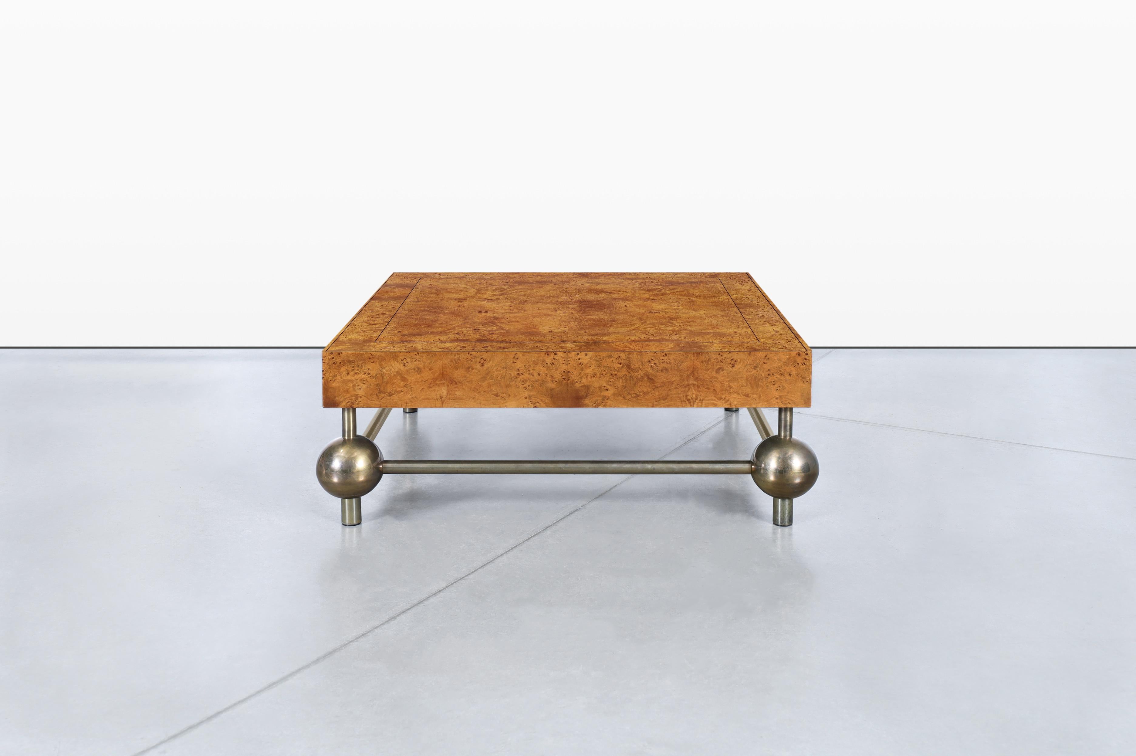 This stunning vintage burl wood coffee table, a true gem from the 1970s, was proudly crafted in the United States. This exquisite piece features a top made from walnut burl wood, highlighting the unique natural beauty and intricate patterns