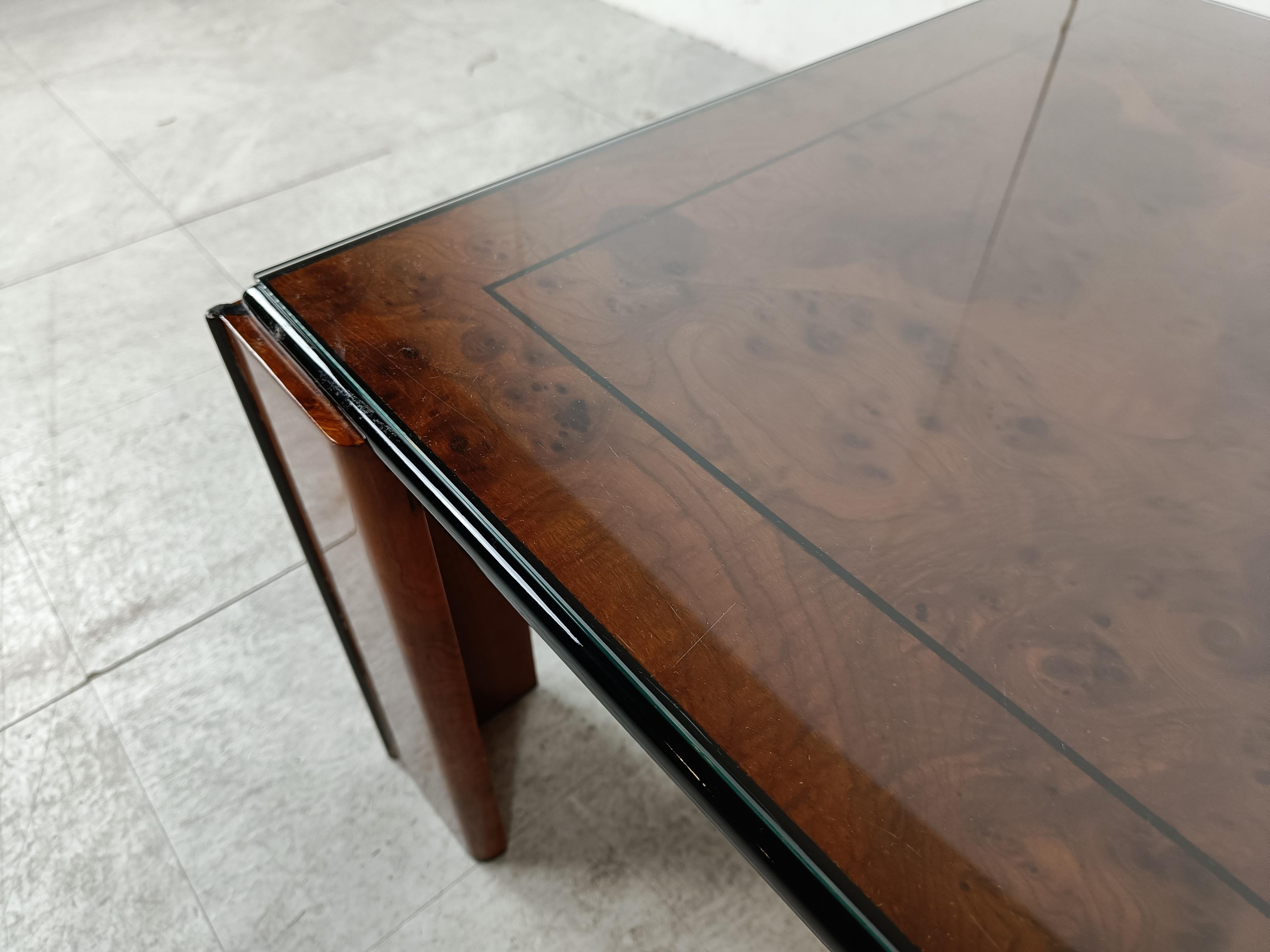 Luxurious looking coffee table with a black lacquered wooden and burl wood frame and top.

Good looking high quality coffee table from the seventies glam period.

1970s - France

Good condition, with normal age related