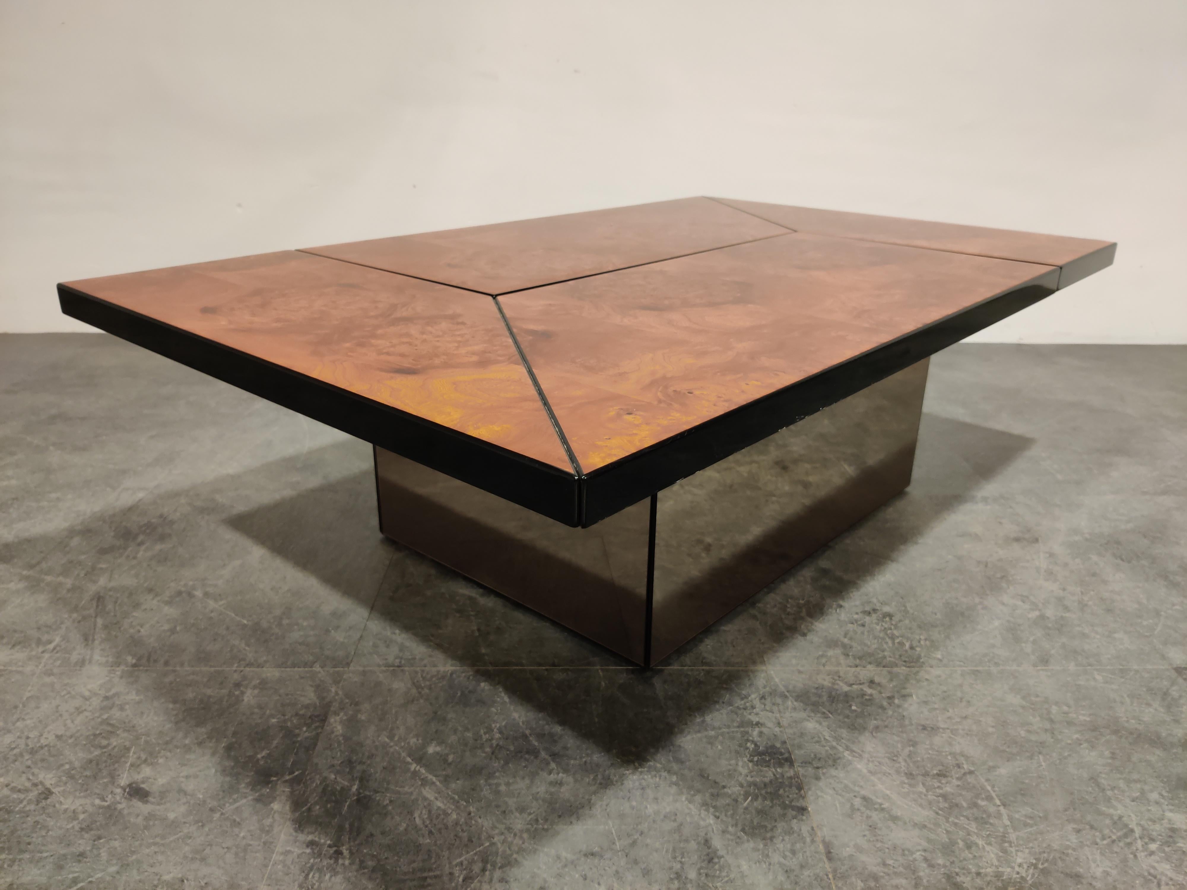 Burl wood coffee table designed by Paul Michel.

This luxurious coffee table is cleverly designed and slides open to reveal a mirrored spacious looking dry bar compartment.

The use of mirrored glass both inside and outside, lacquered finish and