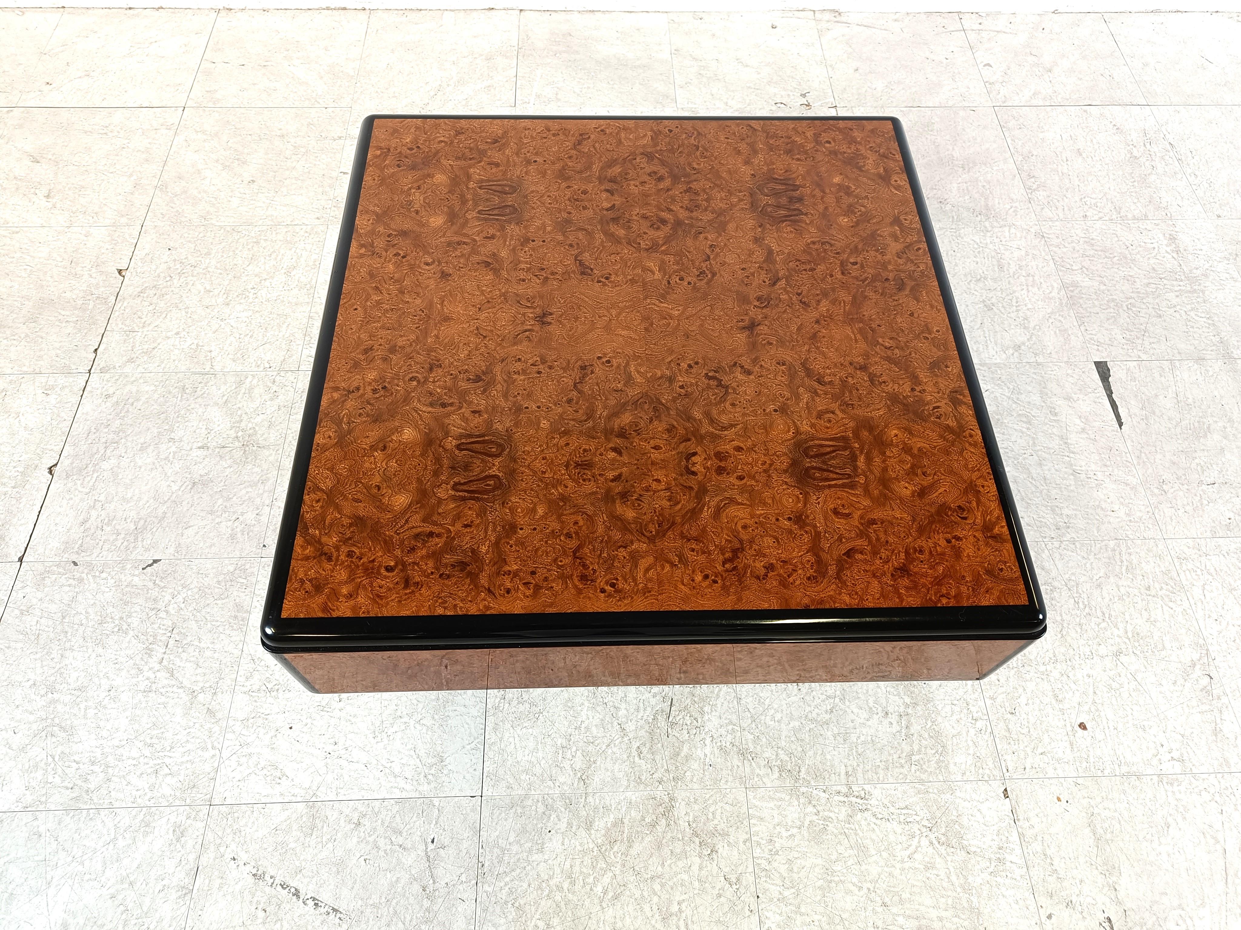 Burl wood coffee table or side table designed by Paul Michel.

Black lacquered wooden base and lacquer edges with burl wood veneer finish.

Luxurious appeal.

Signed on the base.

Good condition. 

1970s - France

Dimensions:
Height: