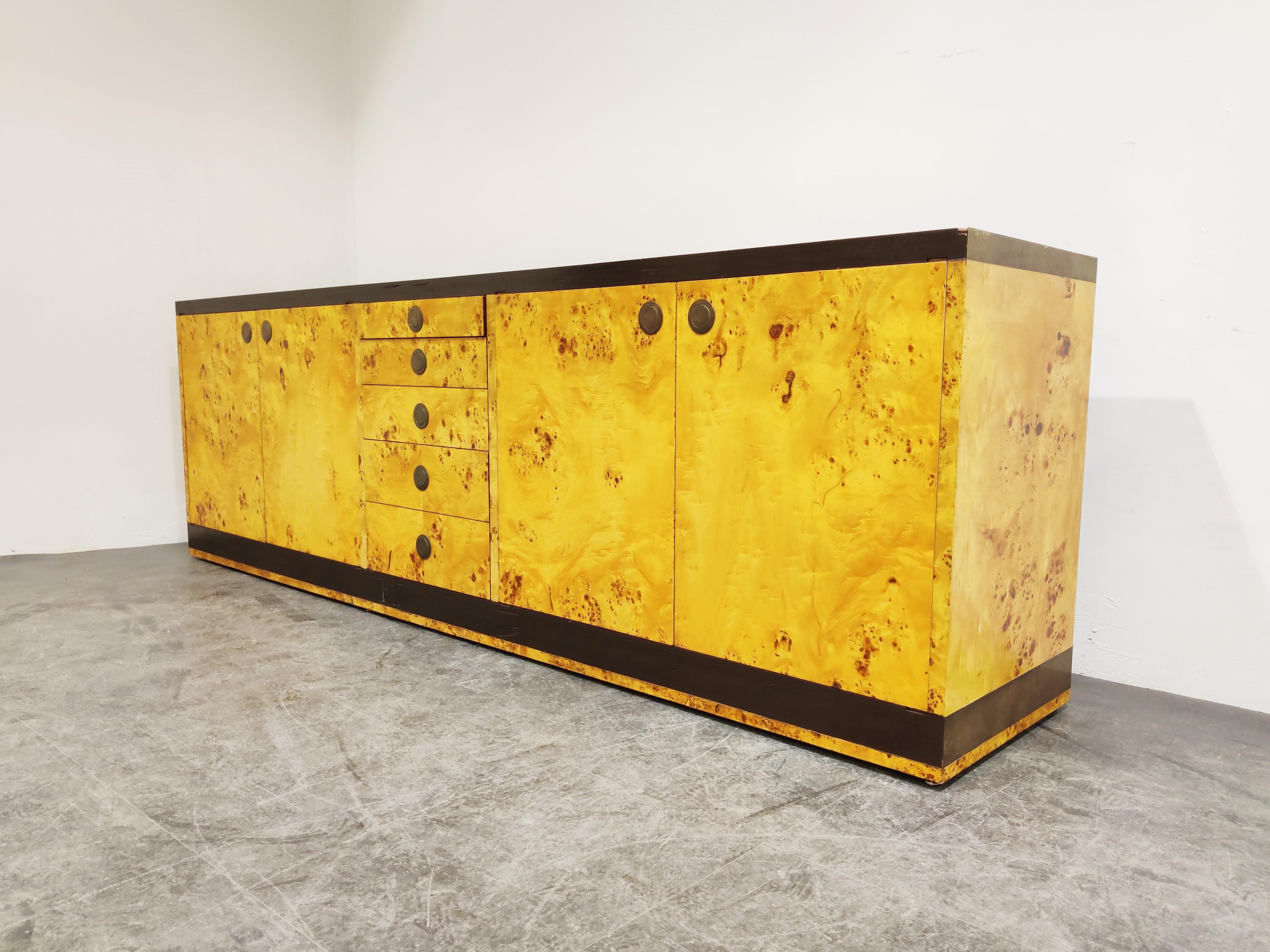 Very rare burled walnut veneer credenza designed by luxury/glamour furniture designer Willy Rizzo.

It features 4 doors and 5 central drawers.

The credenza is made of high quality materials and has a great 1970s-1980s glamourous look.

It
