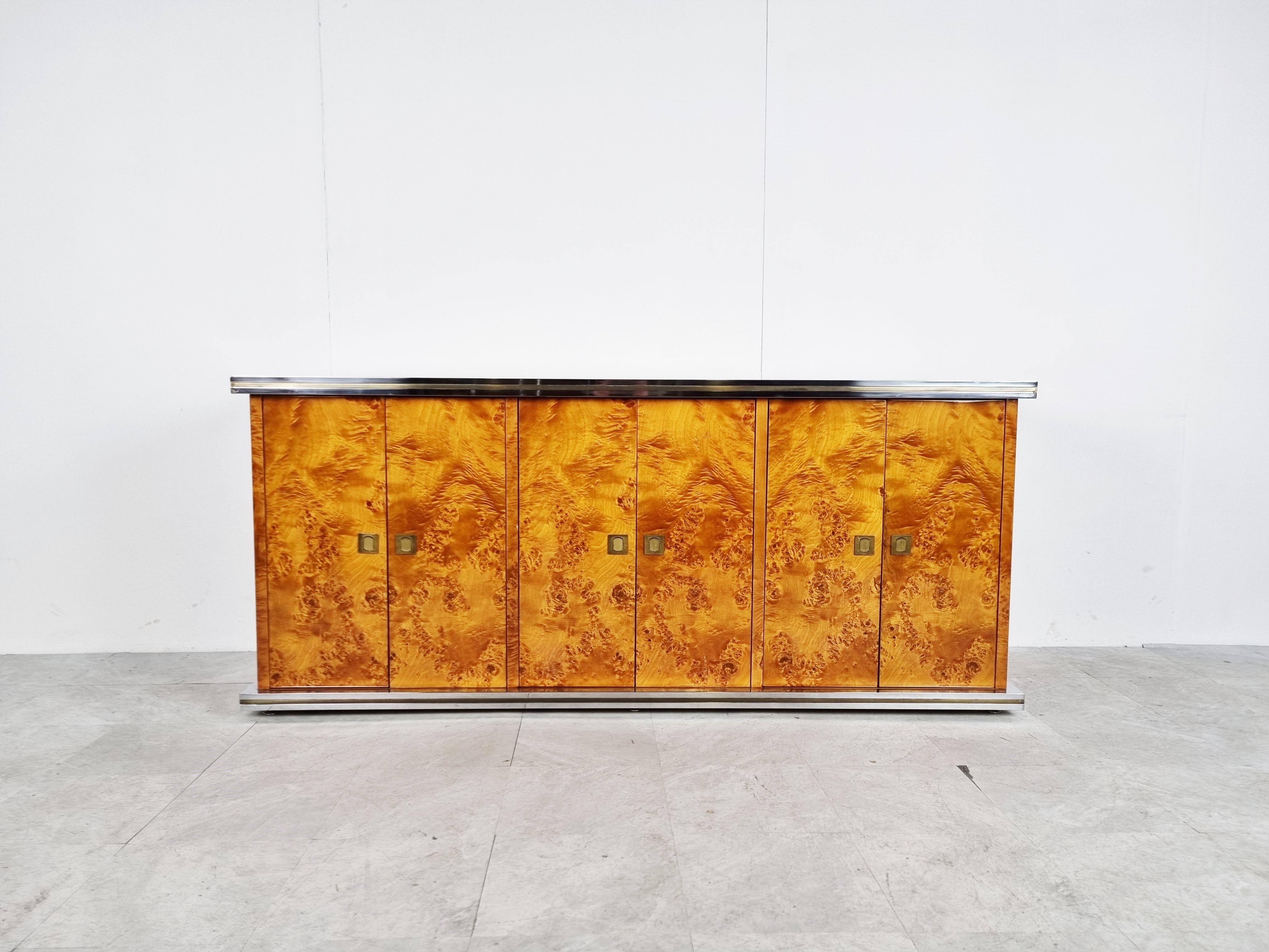 Rare burl veneer credenza designed by luxury/glamour furniture designer Willy Rizzo.

It features 6 doors revealing plenty of storage space

The credenza is made of high quality materials and has a great 1970s - 1980s glamourous look.

It