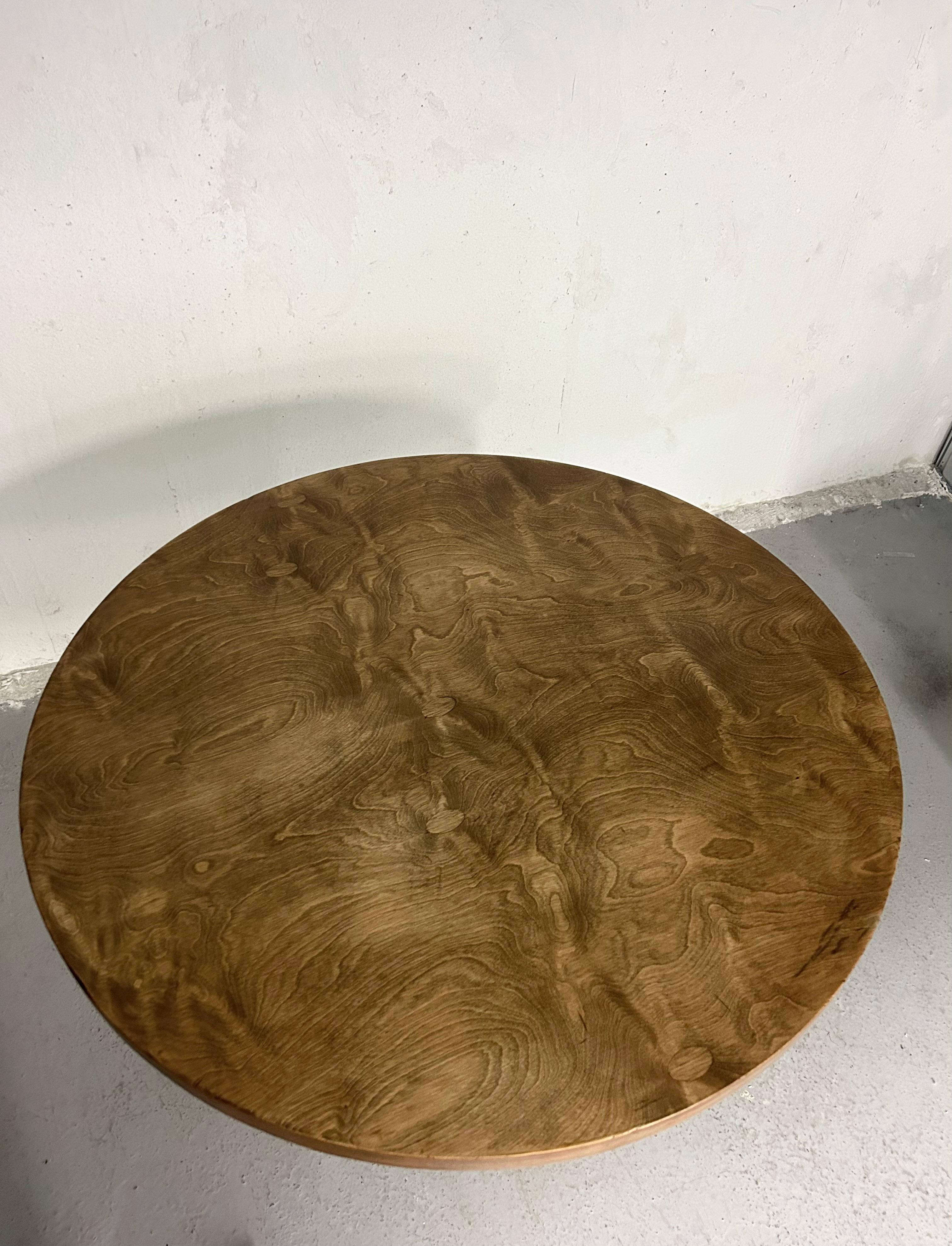 Vintage pedestal dining table. Burl wood veneer top with chrome pedestal base that sits in an aluminum stand. Minimal wear. Some very small knicks in the edge of the table top, normal wear to aluminum stand.