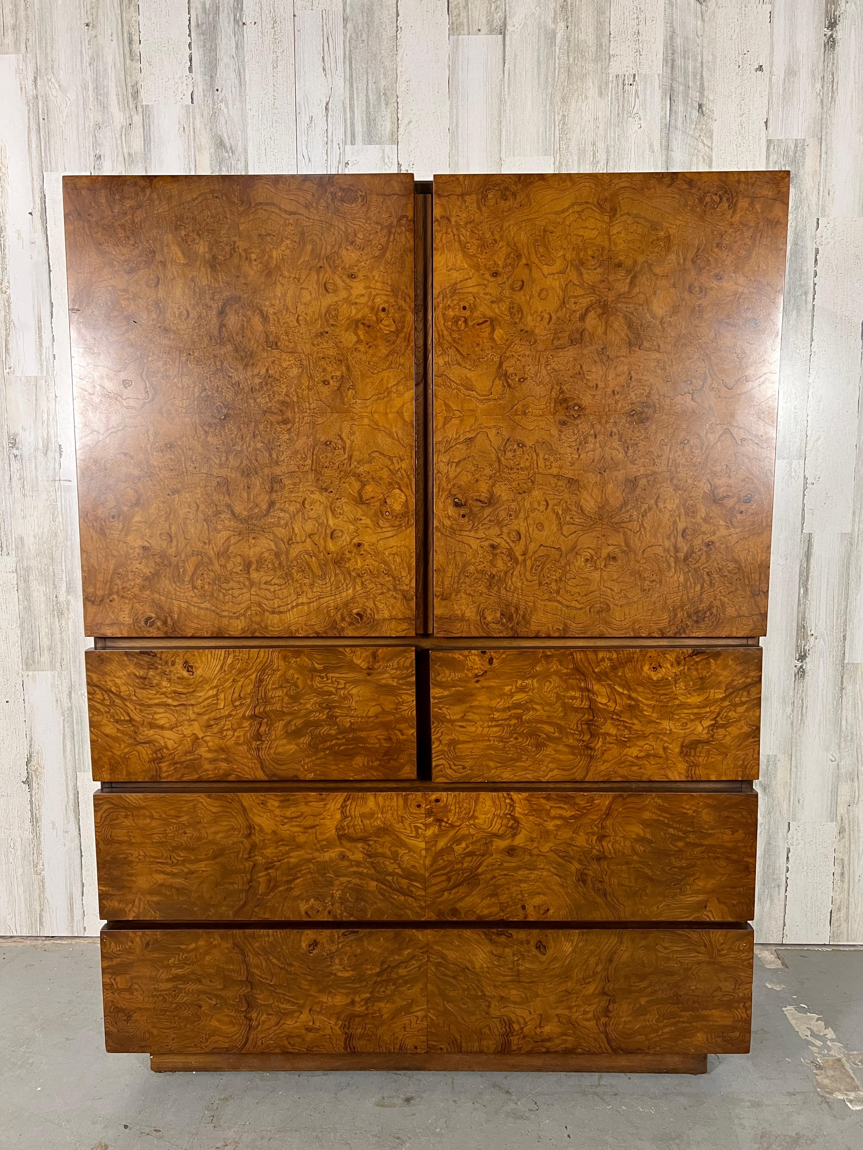 Stunning Burl wood front high-boy dresser with two doors over four drawers.
