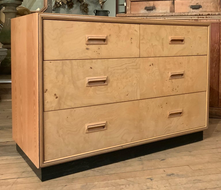 A very handsome vintage 1970's chest in burled Olivewood and Oak by Henredon. Circa 1970, this beautiful chest has an oak case, and the drawer fronts are in very nicely figured burled Olivewood. Several of the drawers are divided, and the top right