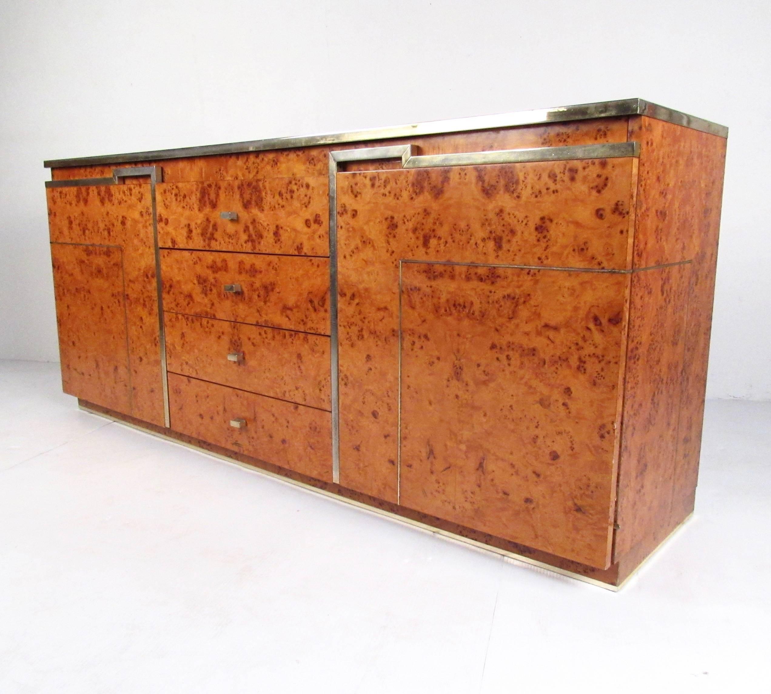 This unique midcentury sideboard features lacquered burl wood finish with brass trim in the style of Romeo Rega offers a stylish and spacious storage option for home or office storage. Carpathian elm with vintage lacquer creates a unique Italian