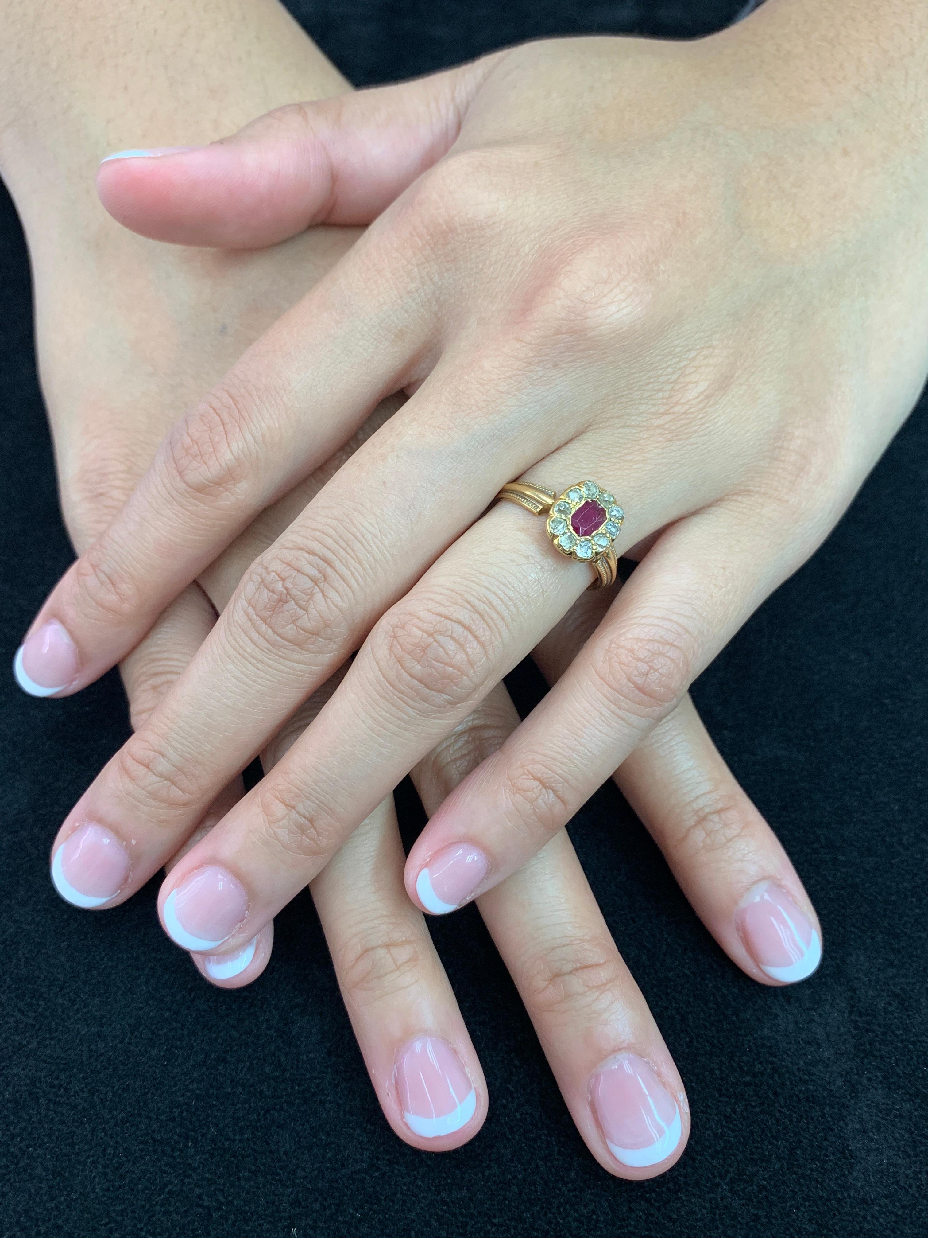 Here is a nice Burma Ruby and diamond ring. The ring is set in yellow gold and old mine cut diamonds. There are 10 old mine cut diamonds that surrounds the center ruby. This ruby ring is full of character. The workmanship of the gold work is simple