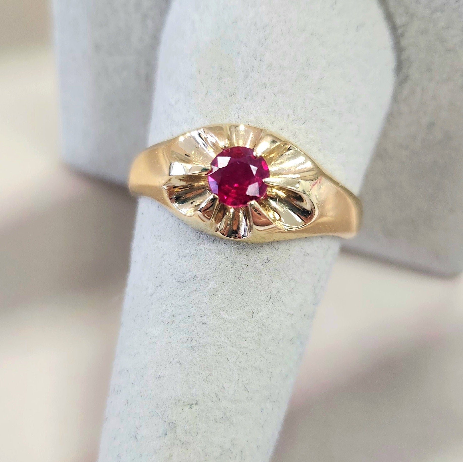 Dapper Men's 14K Gold Ruby Gypsy Ring – Size 9.25

This exquisite men's ruby gypsy ring features a stunning Burma ruby gemstone, renowned for its exceptional quality and vibrant color. The ruby showcases a captivating pigeon blood red hue,