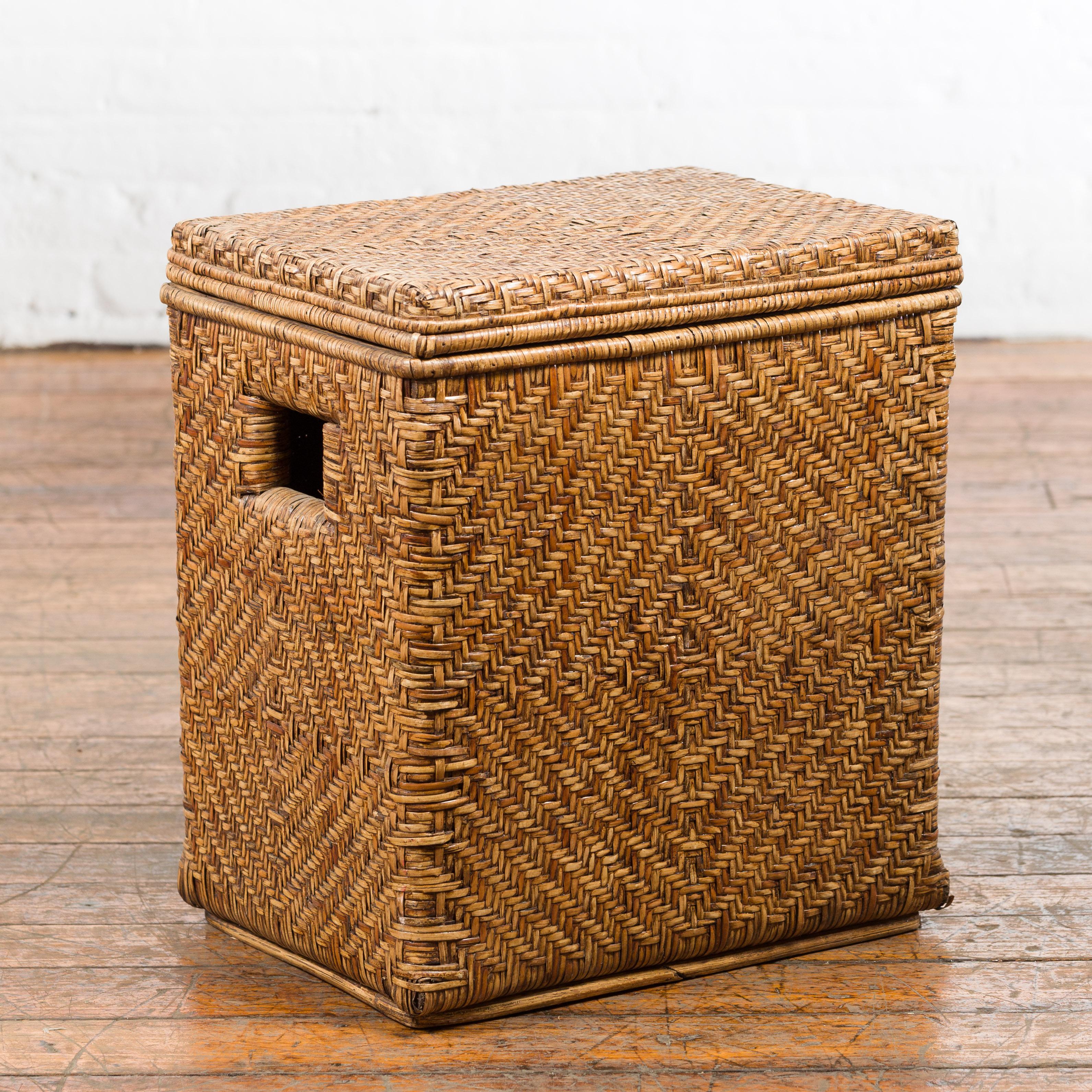A vintage Burmese hand-woven rattan over wood lidded basket from the mid 20th century, with pierced handles. We have several available, priced and sold $490 each. Crafted in Burma during the midcentury period, this handwoven rattan basket, ideal to