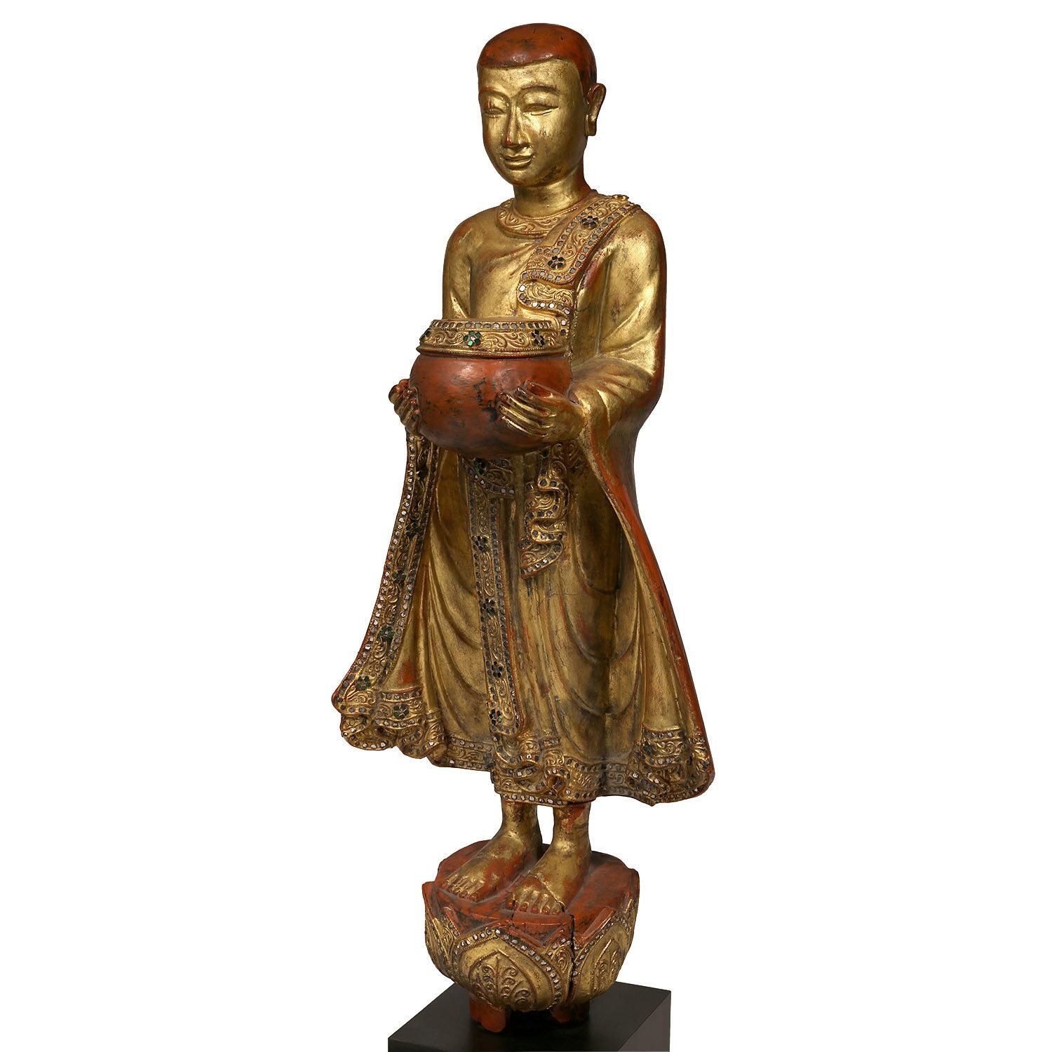 Vintage Burmese Mandalay style bejeweled Buddhist statue

This is the classic Burmese representation of a Buddhist monk.  Depicted in his youth with a sweet face, a friendly, accepting countenance, flowing robes and holding a bowl.  Statues such as
